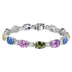 Zafiro ovalado multicolor de 31,46 quilates y pulsera de diamantes redondos