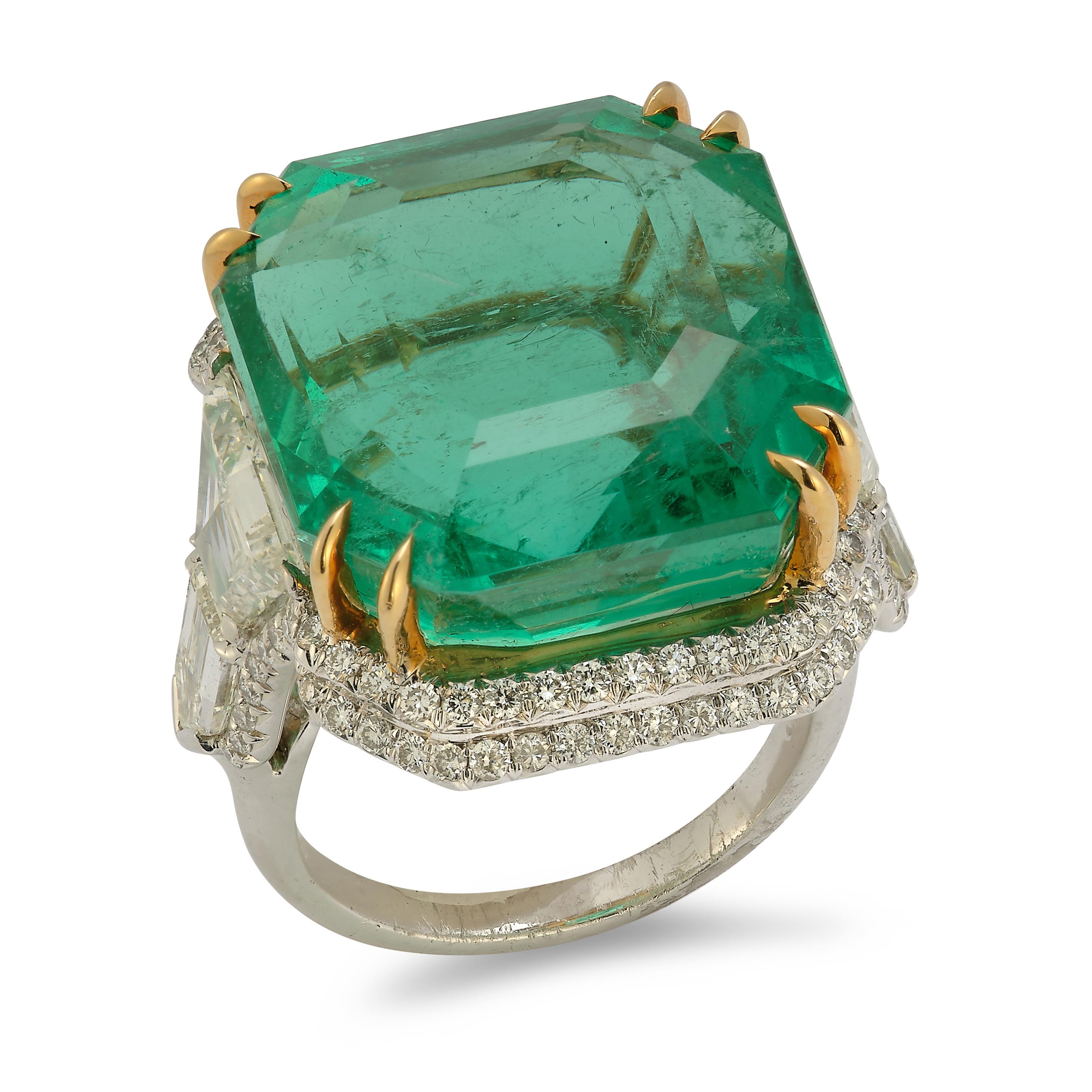 A very fine 31.49 carat Colombian emerald and fancy cut diamond ring.


Colombia origin. Minor Oil