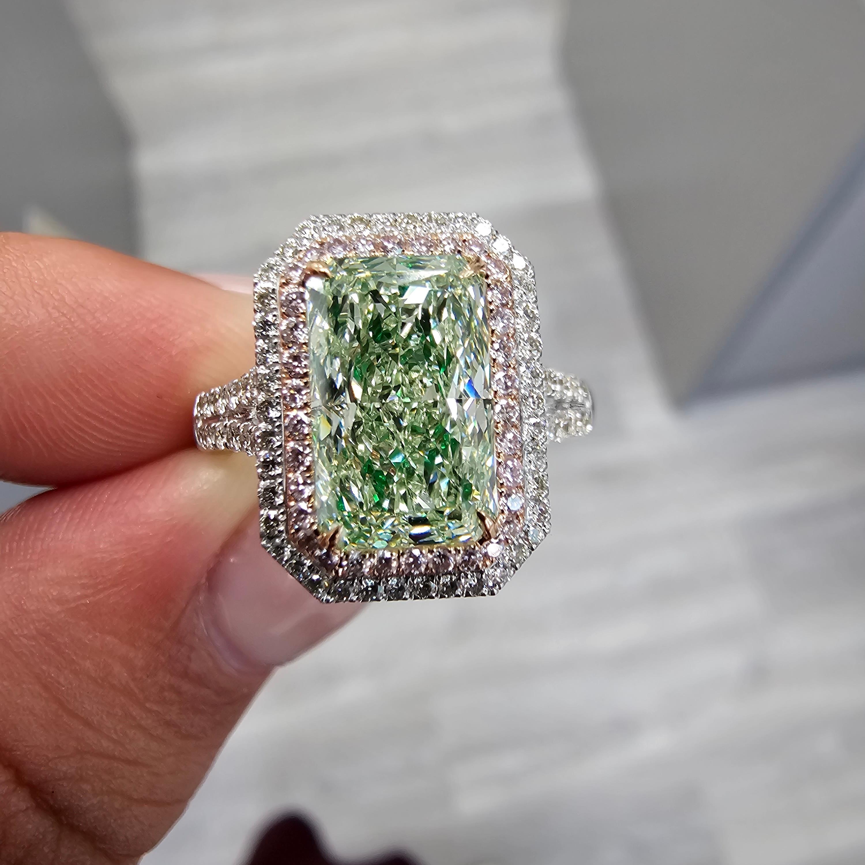 An absolutely killer ring, with an uber elongated radiant cut green diamond that’s cut to perfection.

No spots of color loss, amazing life, and the spread of a 4 Carat diamond!

Excellent and Good Cutting with VS2 Clarity 

Light and sweet lime