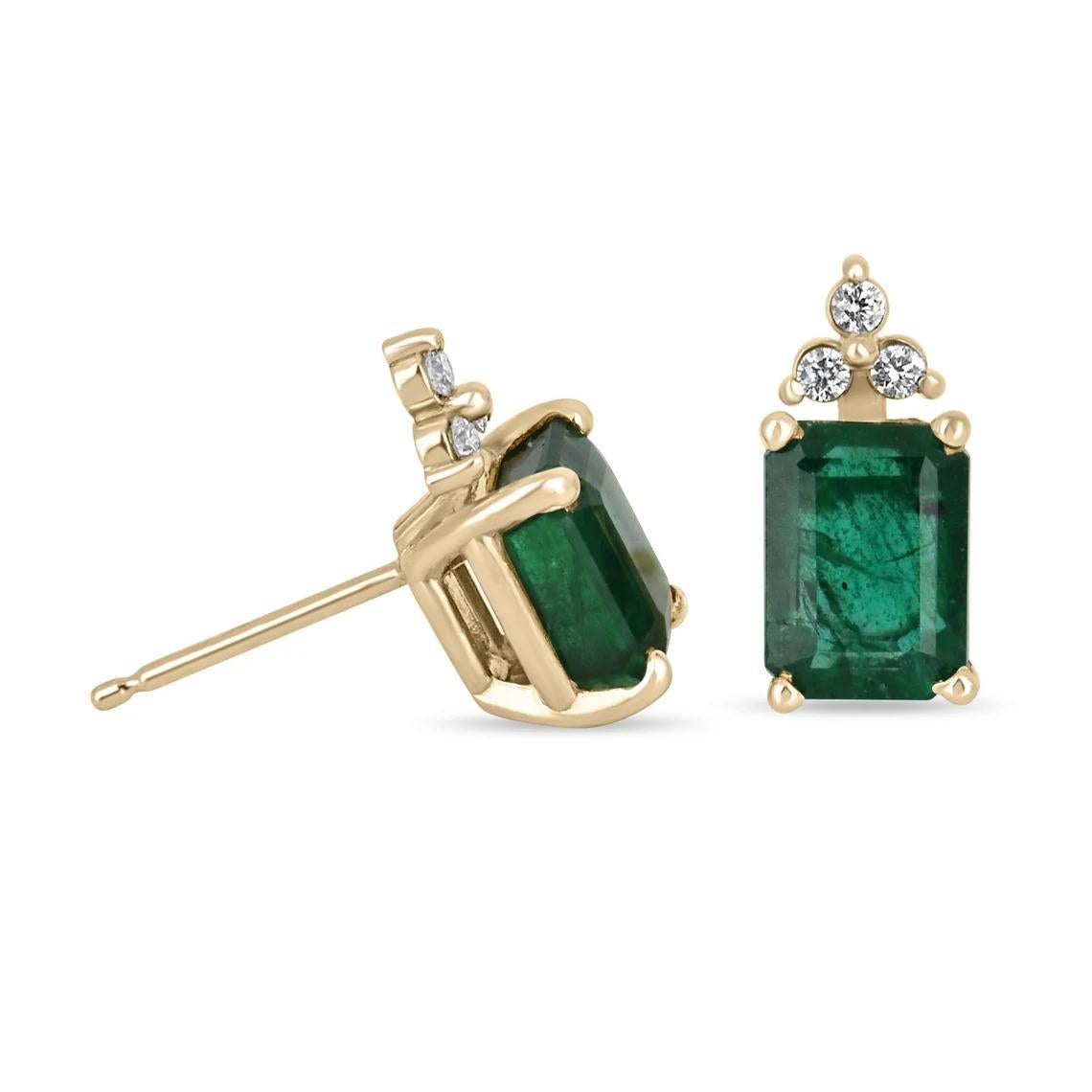 Elegance defined! These emerald and diamond earrings are fashioned in solid 14k yellow gold. These studs feature natural emerald cut emeralds accented with natural white diamonds. The emeralds have a combined 3.08 total carat weight and a dark green
