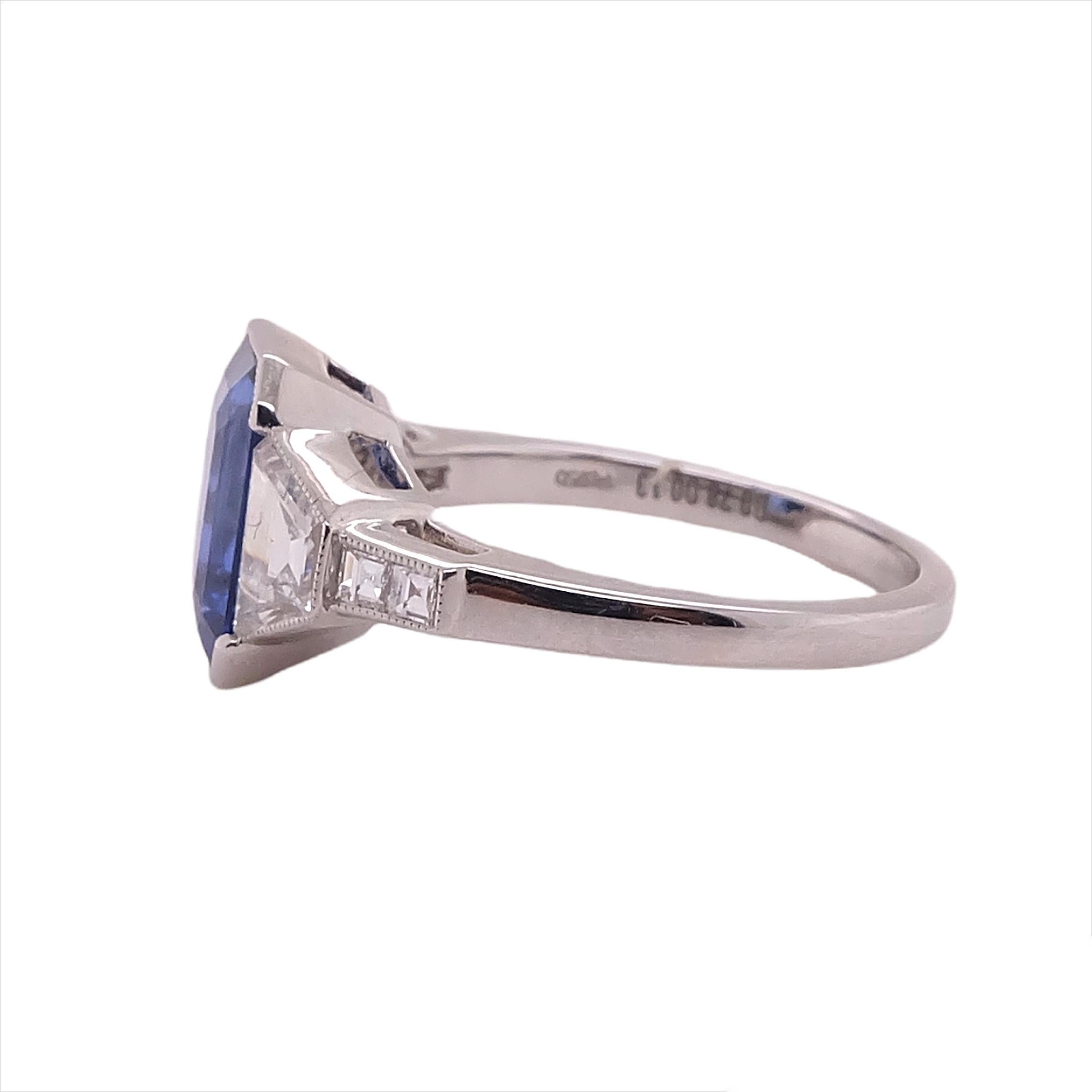 GIA certified 3.15 Carat Blue Sapphire complemented with two 0.78 Trapezoid cut diamond stones and 0.13 carat small diamonds. 

Ring is available for resizing.

Sophia D by Joseph Dardashti LTD has been known worldwide for 35 years and are inspired