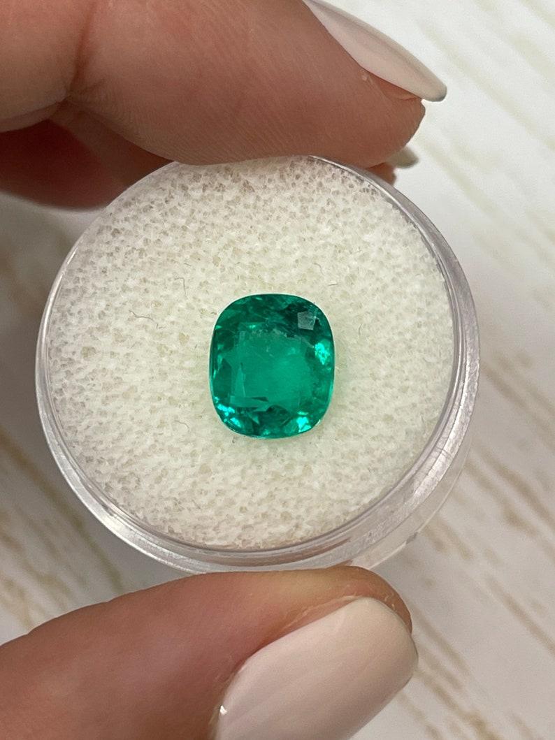 Stone: Emerald
Weight: 3.15-carats
Shape: Cushion Cut
Clarity: Transparent
Luster: Very Good
Color: Bluish Green
Measurements: 9.40mm x 8.12mm x 6.17mm
Geographic Origin: Colombia
Treatment: Natural, Oiling

Comments: Due to their growth conditions