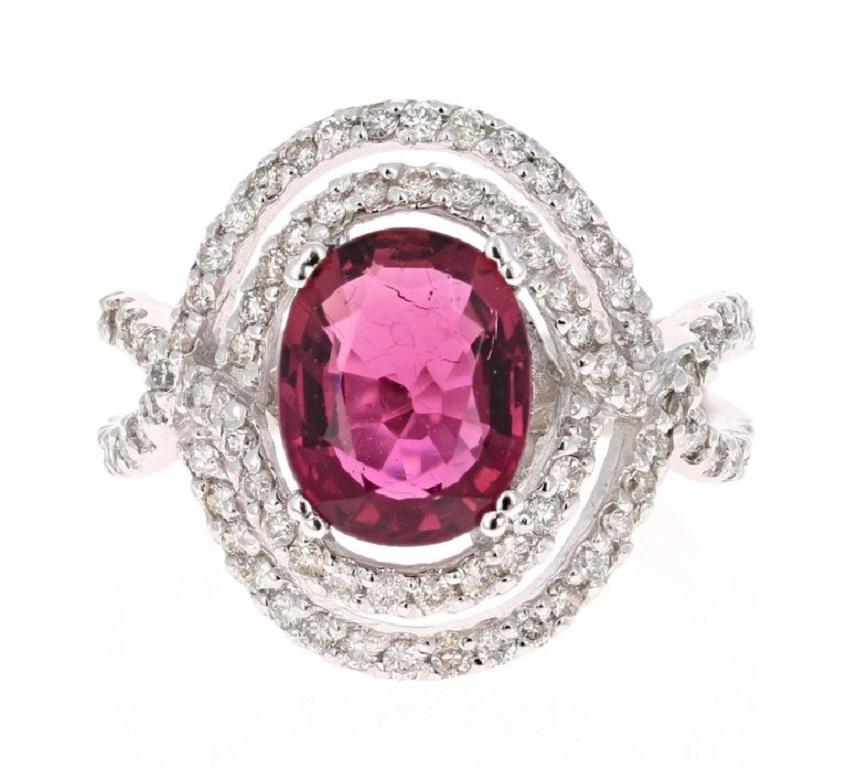 This ring has a Oval Cut Pink Tourmaline weighing 2.35 Carats. There are 88 Round Cut Diamonds weighing 0.80 Carats. The total carat weight of the ring is 3.15 carats. The tourmaline measures at 10 mm x 8 mm. 

It is set in 14K White Gold and is a