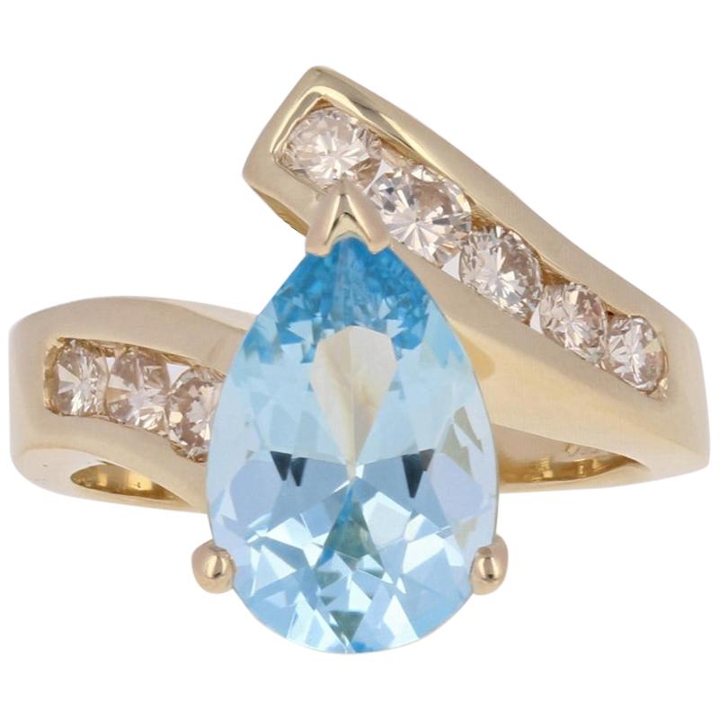 3.15 Carat Pear Cut Aquamarine and Diamond Ring, 14 Karat Yellow Gold Bypass