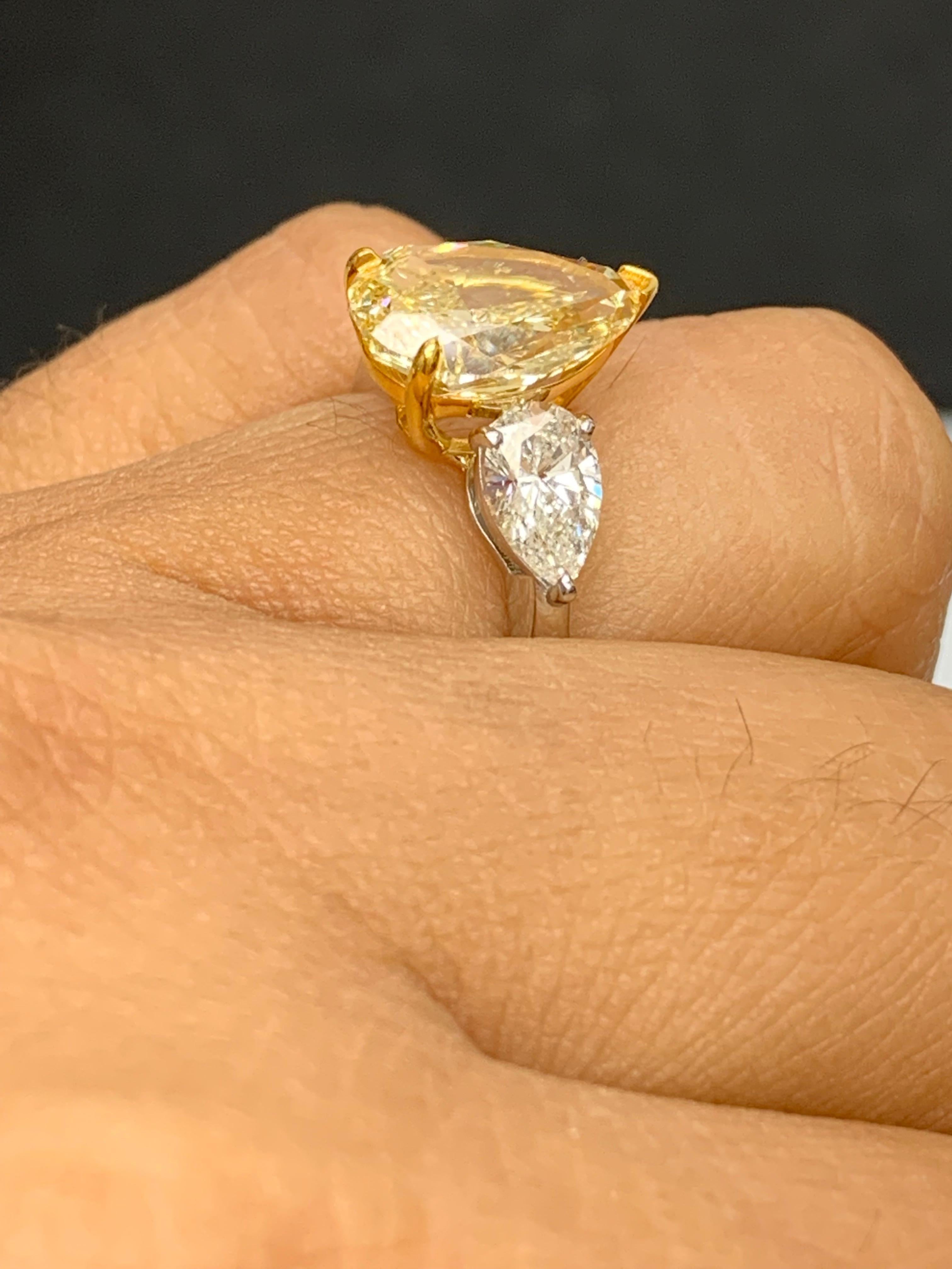 3.15 Carat Pear Shape Fancy Yellow Diamond 3 Stone Ring in Platinum For Sale 5