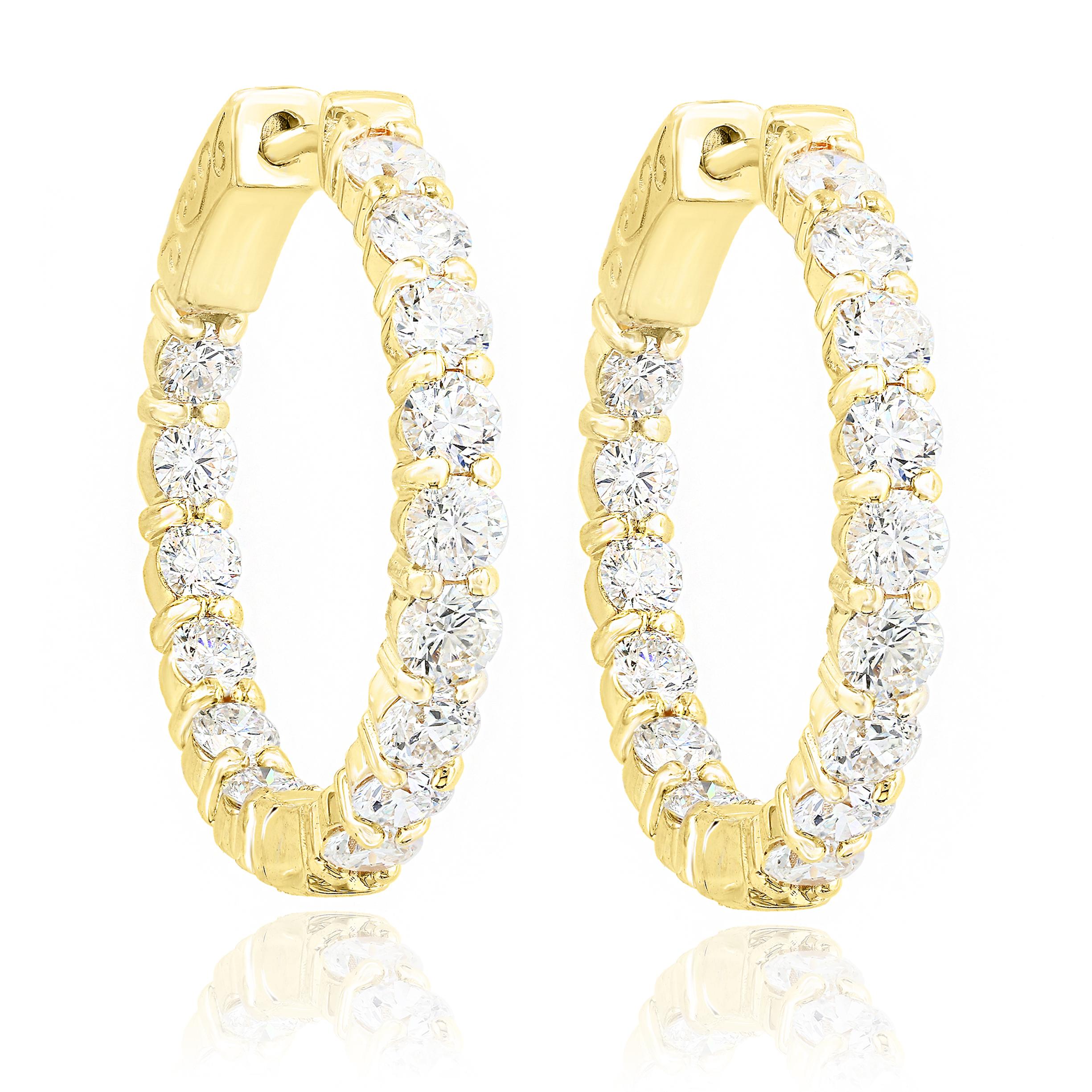 A chic and fashionable pair of hoop earrings showcasing  round diamonds, set in 14k yellow gold.  30 Round diamonds weigh 3.15 carats total. A beautiful piece of jewelry.


All diamonds are GH color SI1 Clarity.
Available in Yellow and Rose Gold as