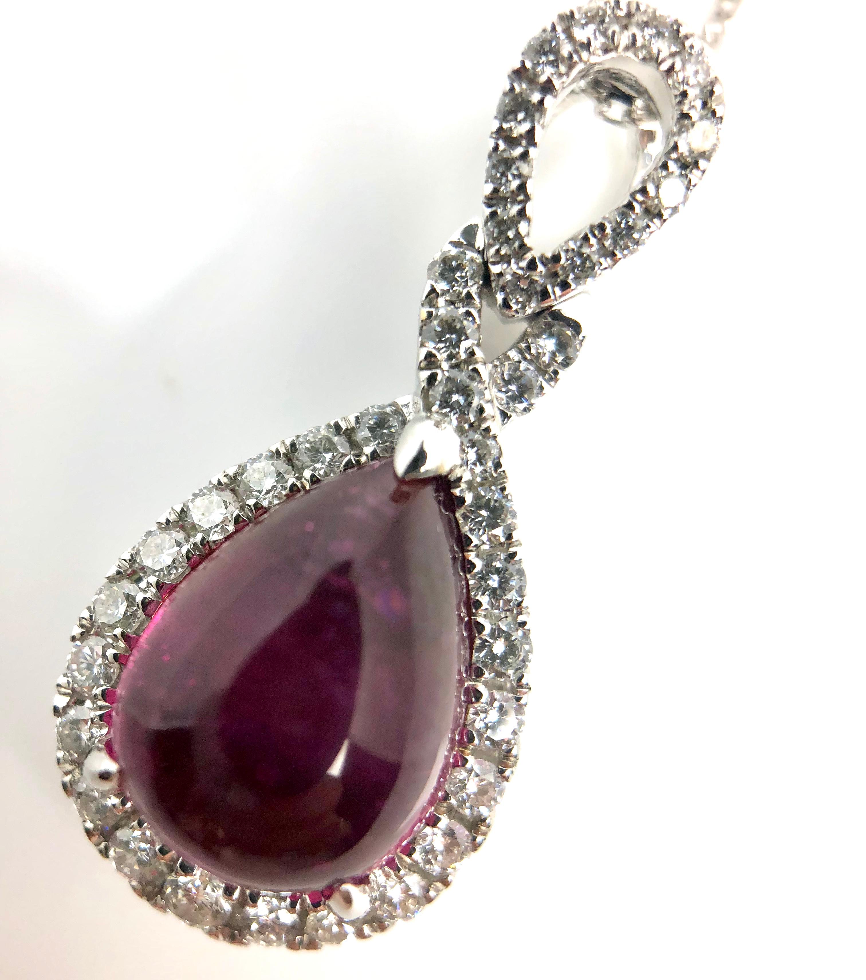 This lovely halo pendant features 3.15 carats Pear Shape Rubelite, surrounded by a halo of round white diamonds.

Center: 3.15 carats Rubelite
Diamond Halo: 38 round diamonds total 0.34 carats
Set in 18k White Gold.

Many of our items have matching