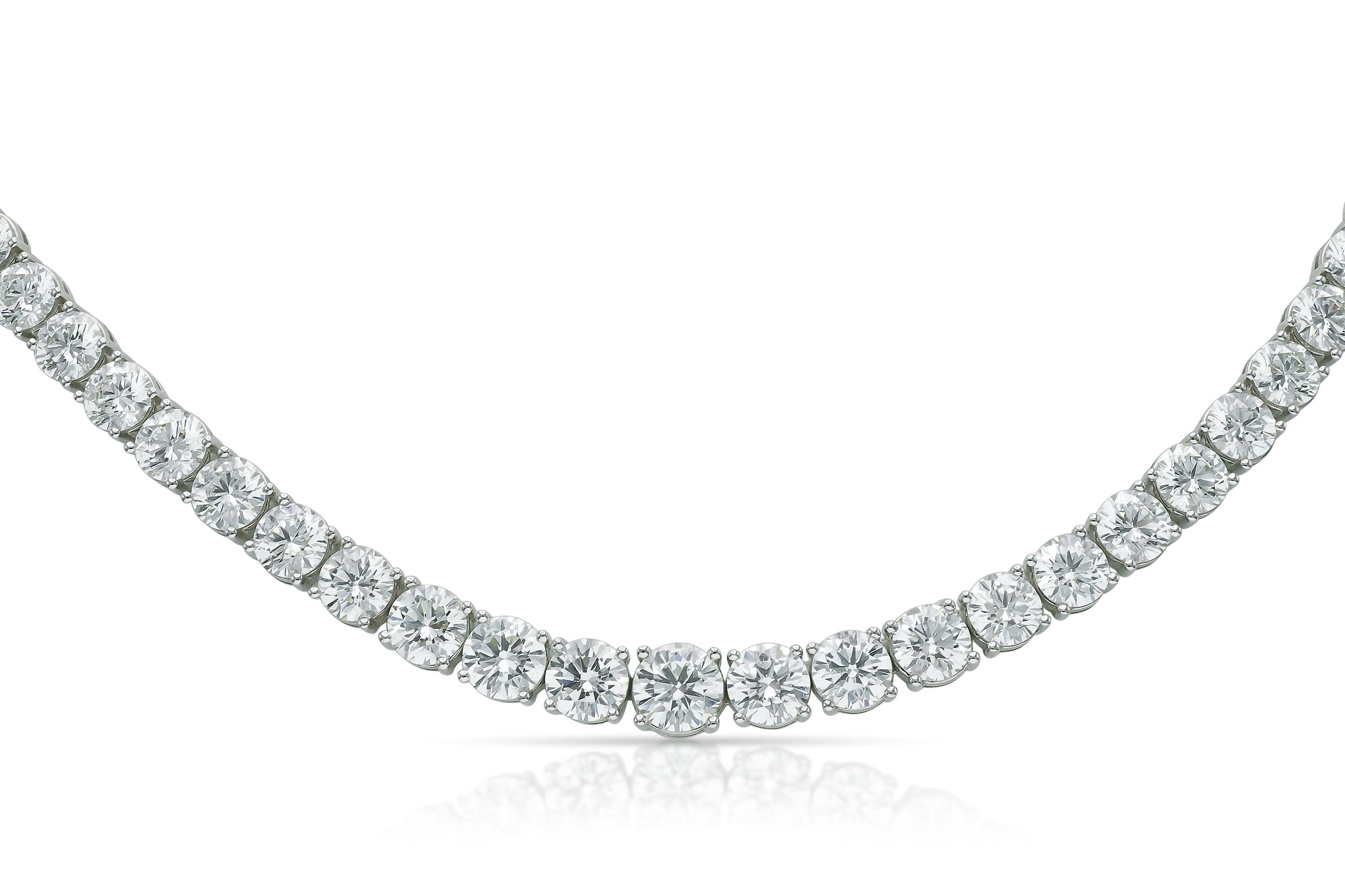 Finely crafted in 18k white gold with 91 slightly graduating Round Brilliant cut Diamonds weighing a total of approximately 31.56 carats; the center Diamond weighing 1.01 carats, G color, VS clarity.
16 1/2 inches long