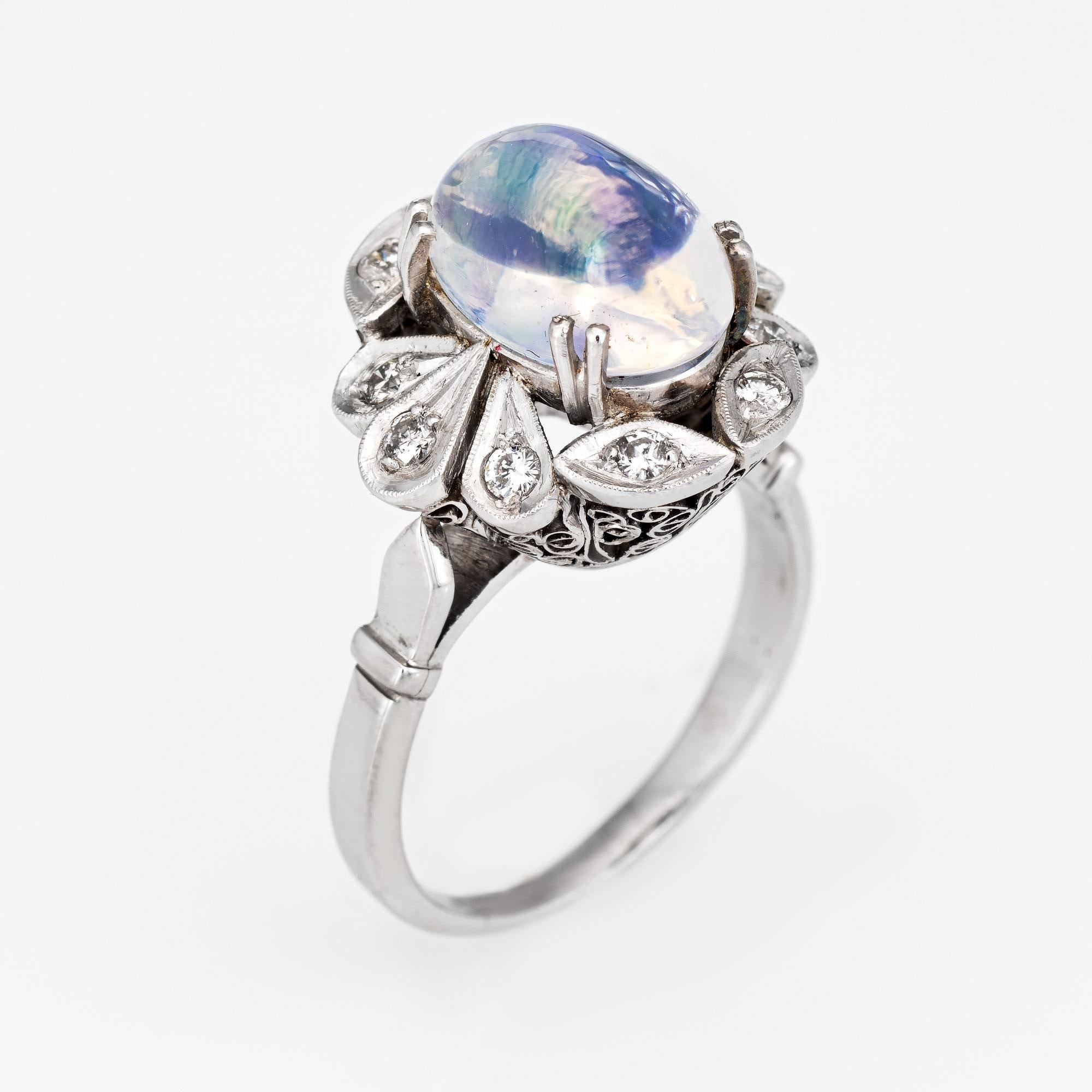 Stylish natural jelly opal & diamond cocktail ring crafted in 900 platinum. 

Cabochon cut natural jelly opal, 3.15 carats (11.33 x 7.29 x 6.31mm). The opal  is in excellent condition and free of cracks or chips. The opal exhibits a strong play of