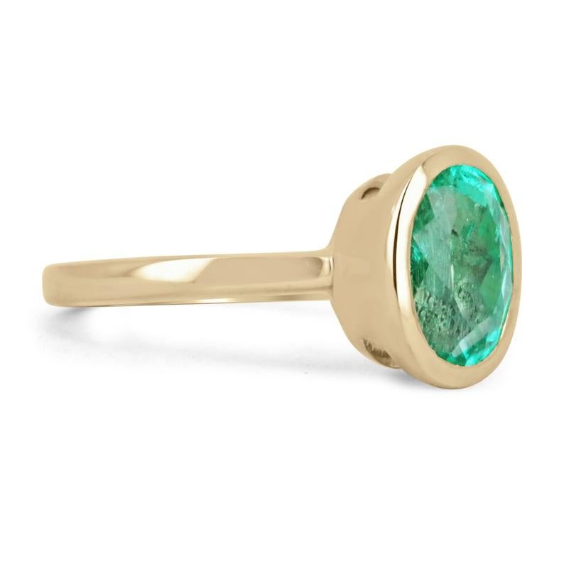 Simple, sophisticated, and elegant- that is what this gorgeous ring displays. A beautiful and vivid, Colombian emerald, oval cut with excellent luster set into an 18K yellow gold bezel-set, solitaire setting. Admirable from any angle.

Setting