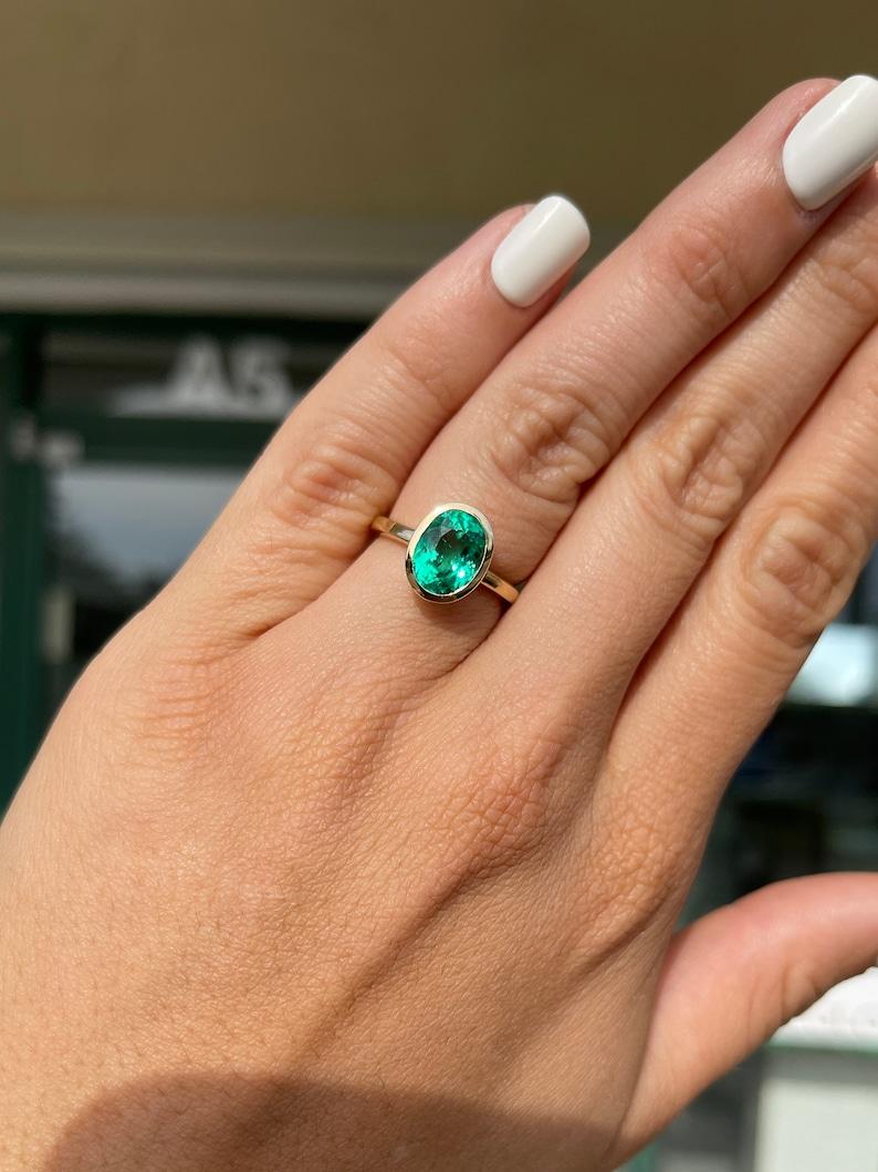 3.15cts 18K Bezel Set Oval Emerald Engagement Ring  Yellow Gold In New Condition For Sale In Jupiter, FL