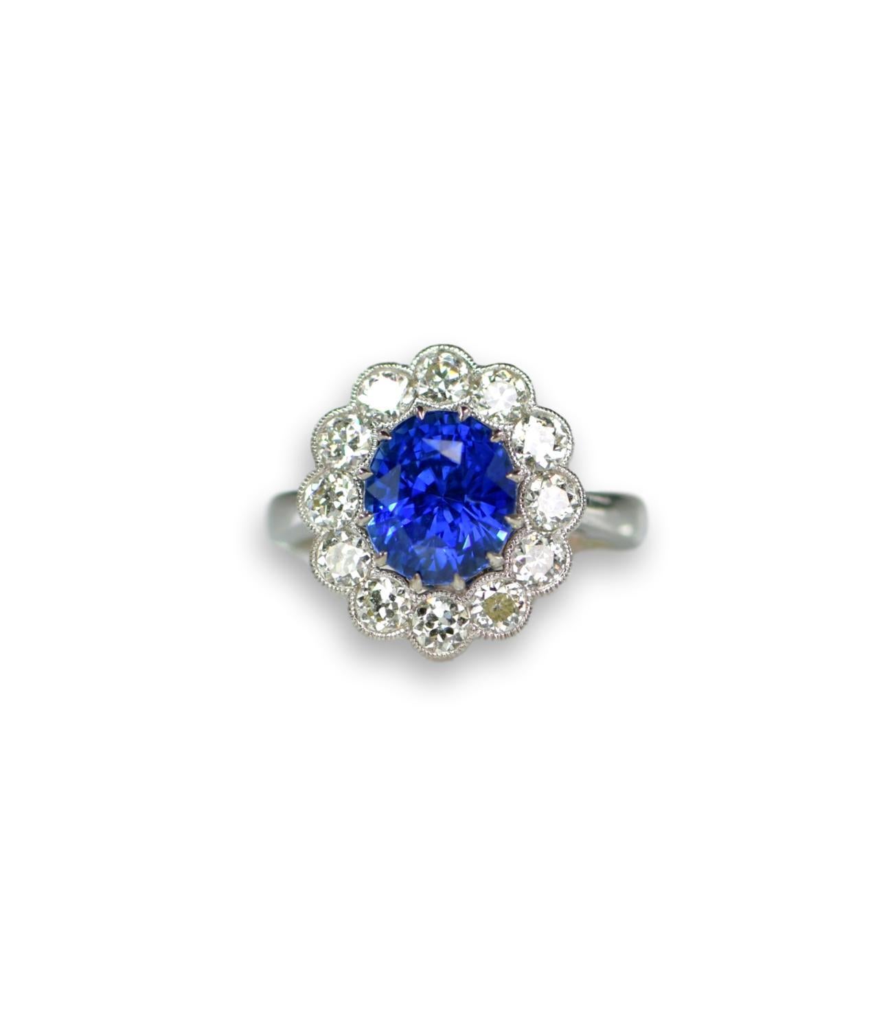 3.16 Carat Blue Sapphire and Diamond Cluster Engagement Ring In Excellent Condition In Banbury, GB