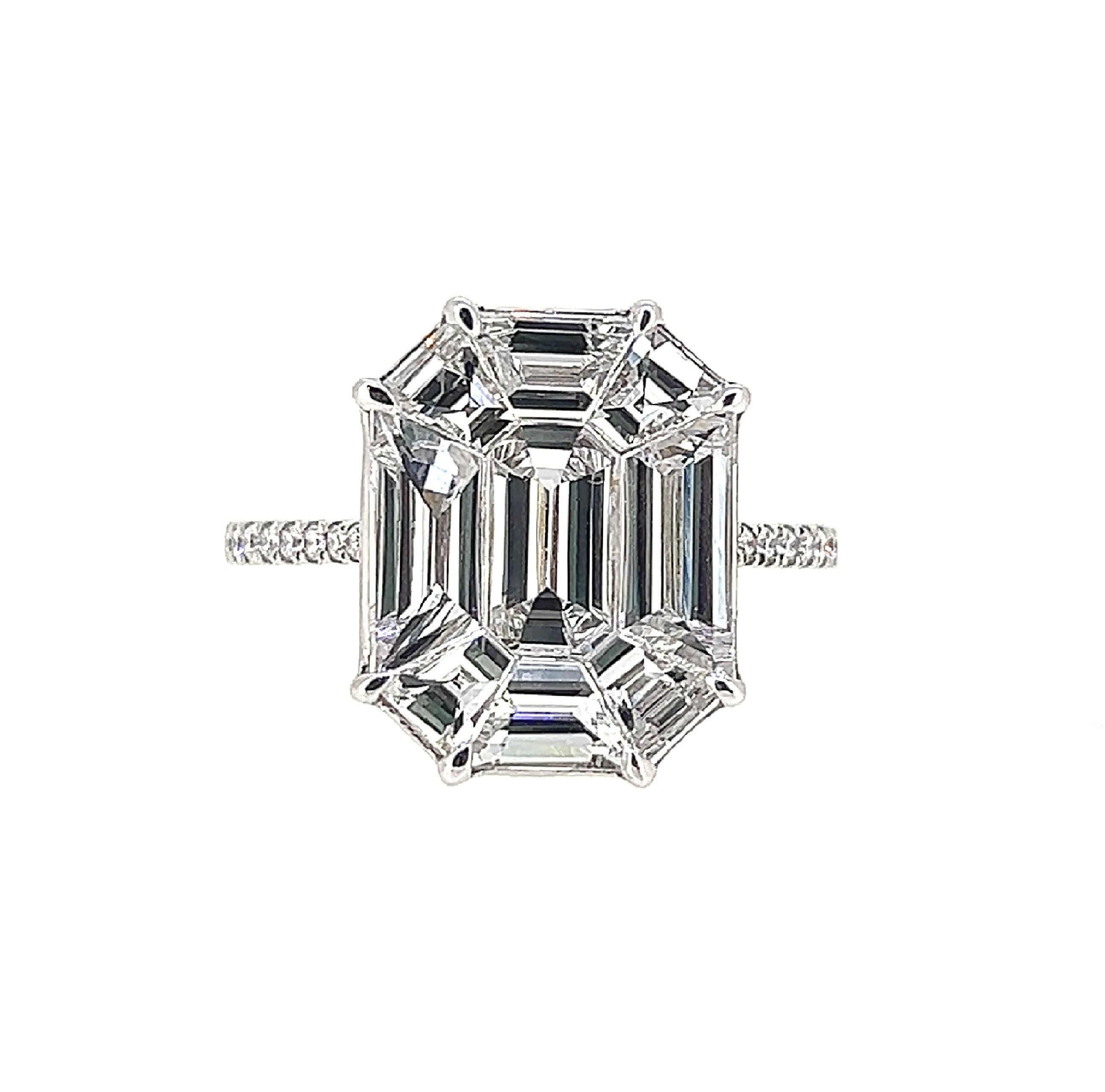 This is an elegant and classy ring that makes a beautiful gift; it’s illustrated table size looks as grand as a 10 Carat Diamond!  Crafted on 18 Karat White Gold, this invisible setting Diamond Ring is a crafty design which features 9 Step cut