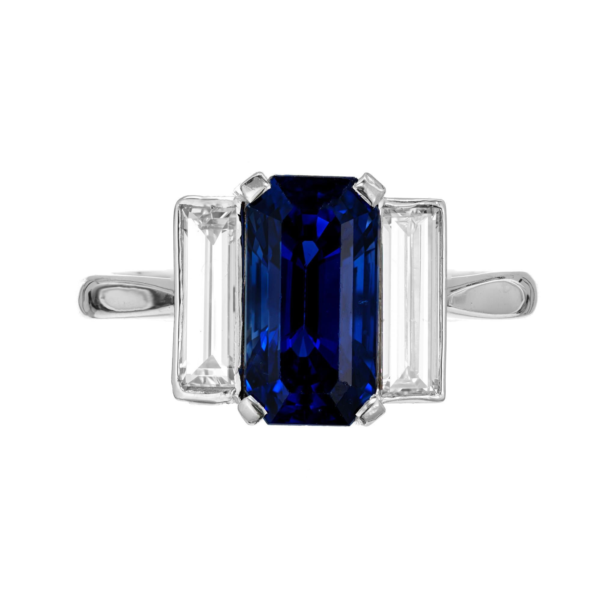 Original 1920's distinctive Art Deco Ceylon Sapphire diamond engagement ring. AGL certified emerald cut 3.16ct center sapphire. Set in a platinum three-stone setting with two matching emerald cut accent diamonds. Simple heat only. 

1 natural
