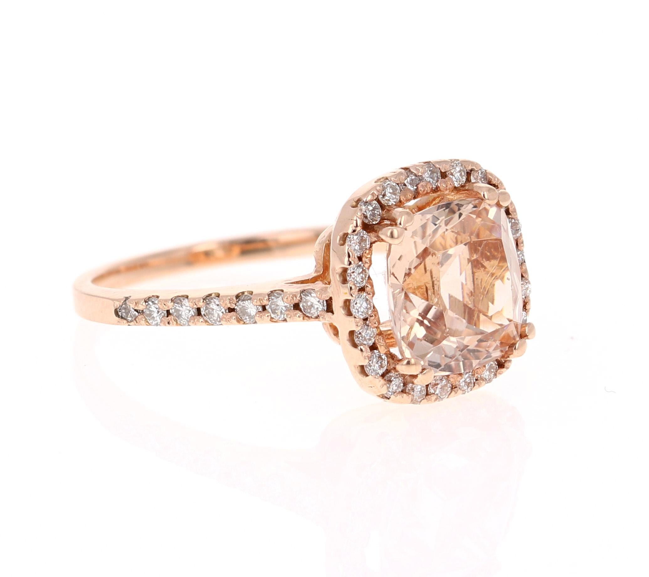 A lovely Engagement Ring Option! This simple yet gorgeous Morganite Ring has a 2.67 Carat Cushion Cut Morganite as its center and has a beautiful simple halo of 38 Round Cut Diamonds that weigh 0.49 carats. (Clarity: VS, Color: H) The total carat