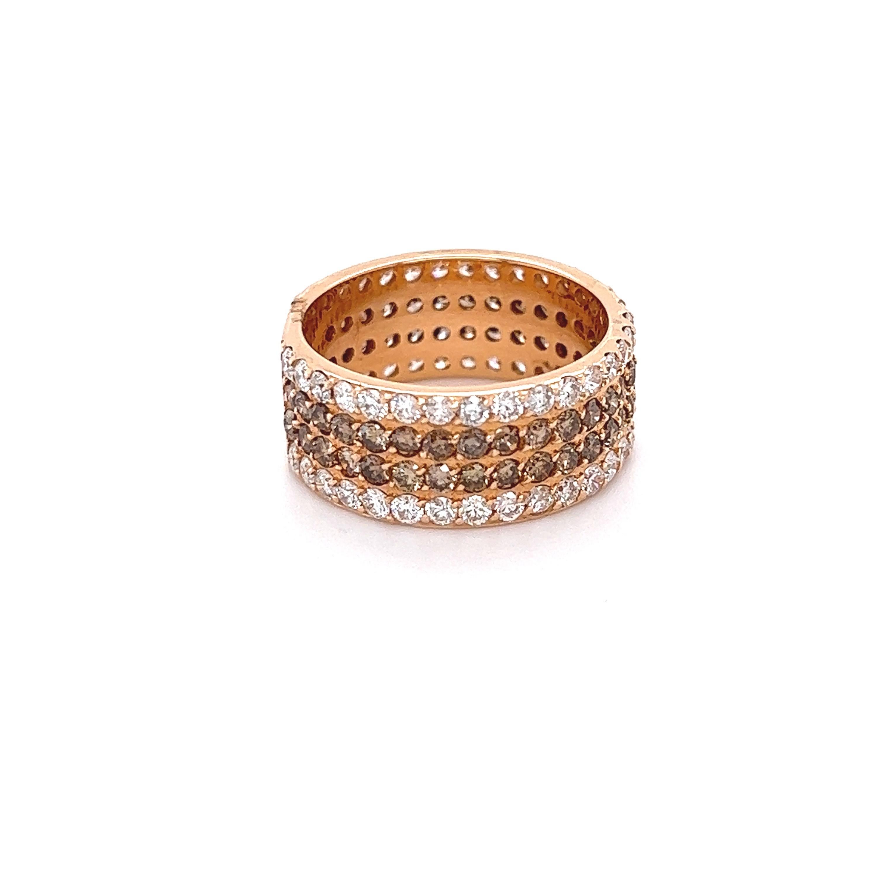 This Natural Brown Diamond and White Diamond Band is stunning and versatile! Can be worn as a wedding or engagment band or as a gorgeous cocktail ring or an everyday stunner! 

There are 60 Natural Round Cut Champagne/Brown Diamonds that weigh 1.68