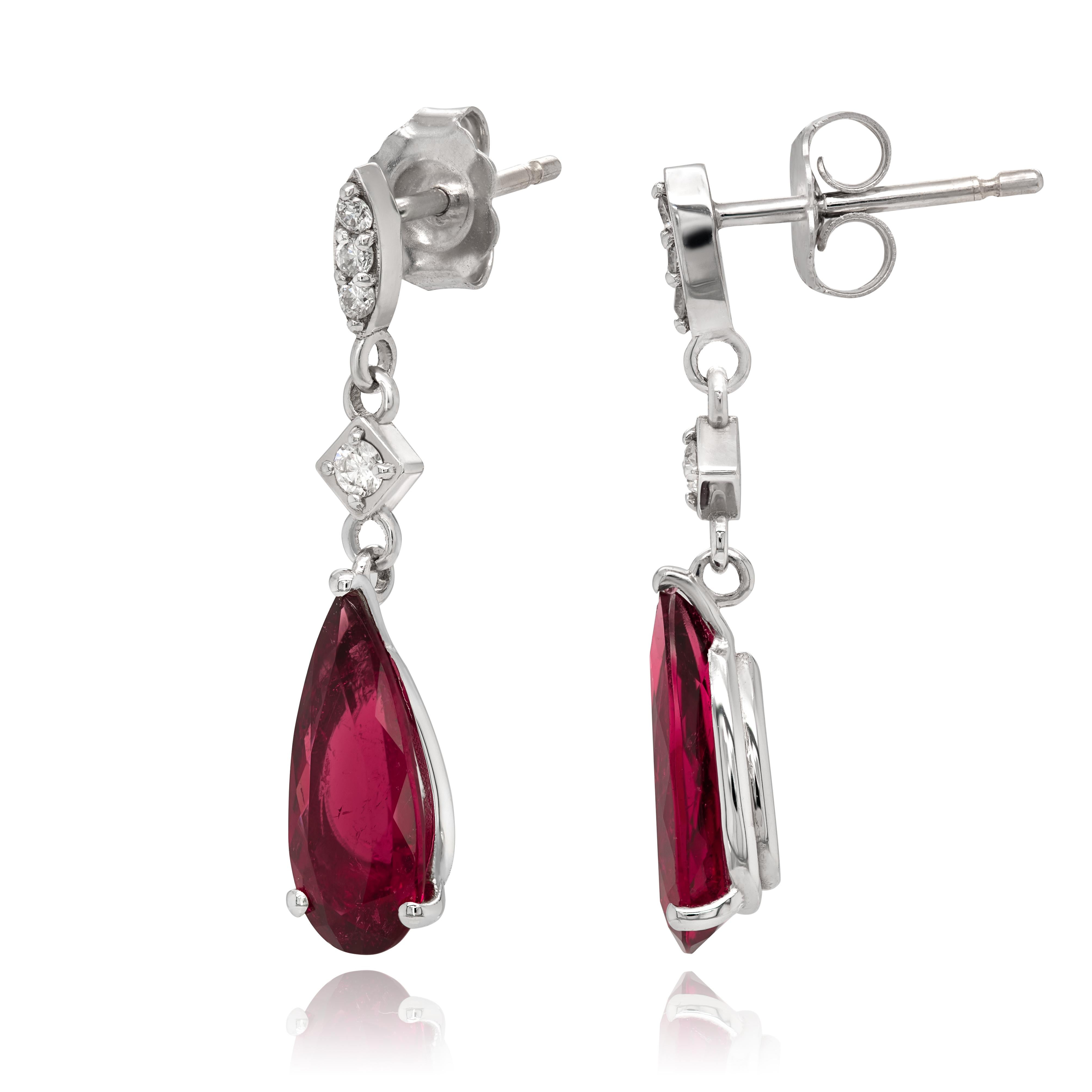 Rubellites are part of the tourmaline family that boasts a vivid fuchsia red color. Filled with a rich bougainvillea purplish red that comes alive thanks to the gems flawless cut, this pair of cascading Rubellite earrings will surely bring a smile