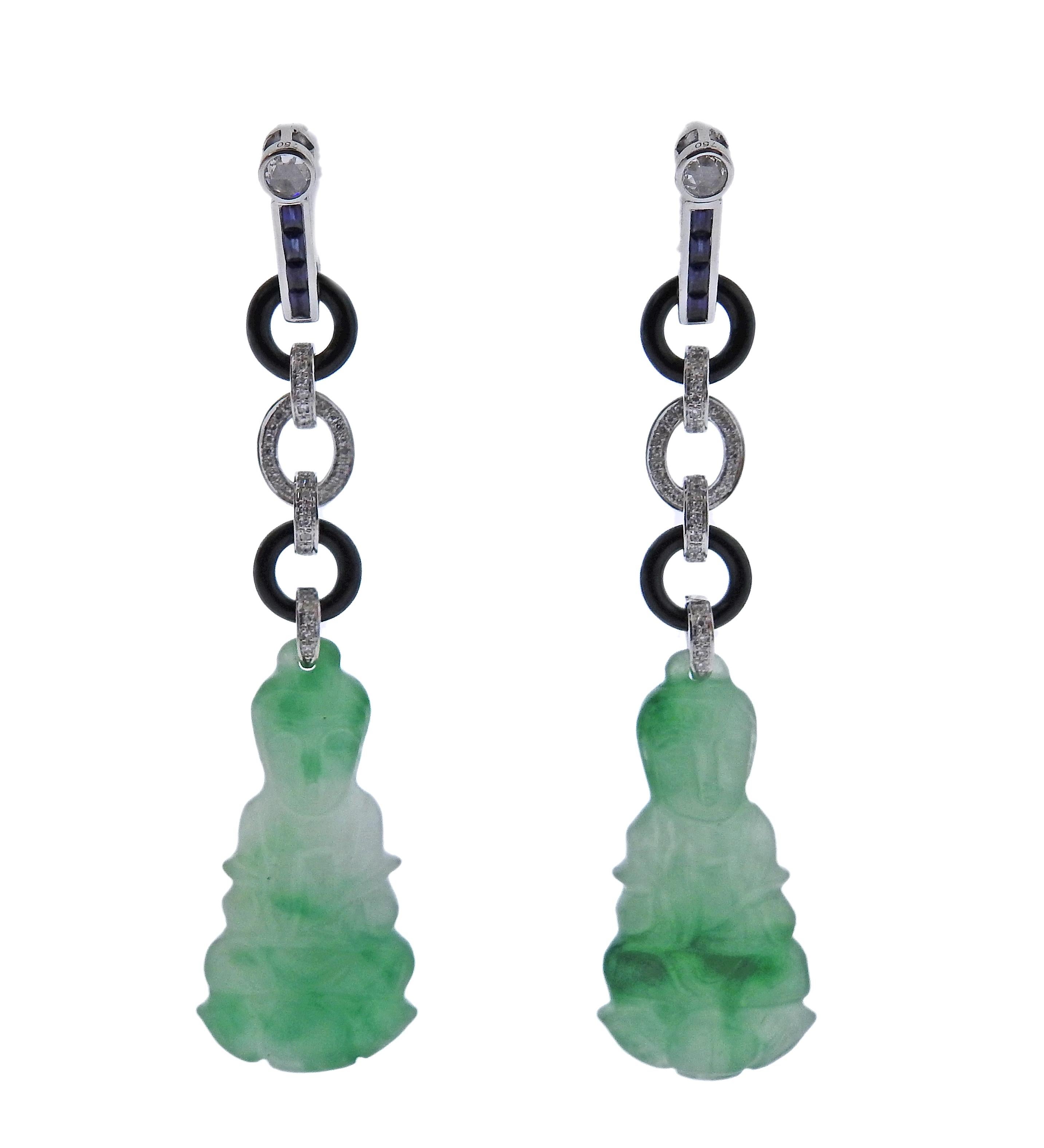 Pair of 18k gold long drop earrings, with 31.63ctw in carved jadeite jade, sapphire, onyx and 0.28ctw in diamonds. Earrings are 65mm long. Marked 750. Weight - 12.8 grams.