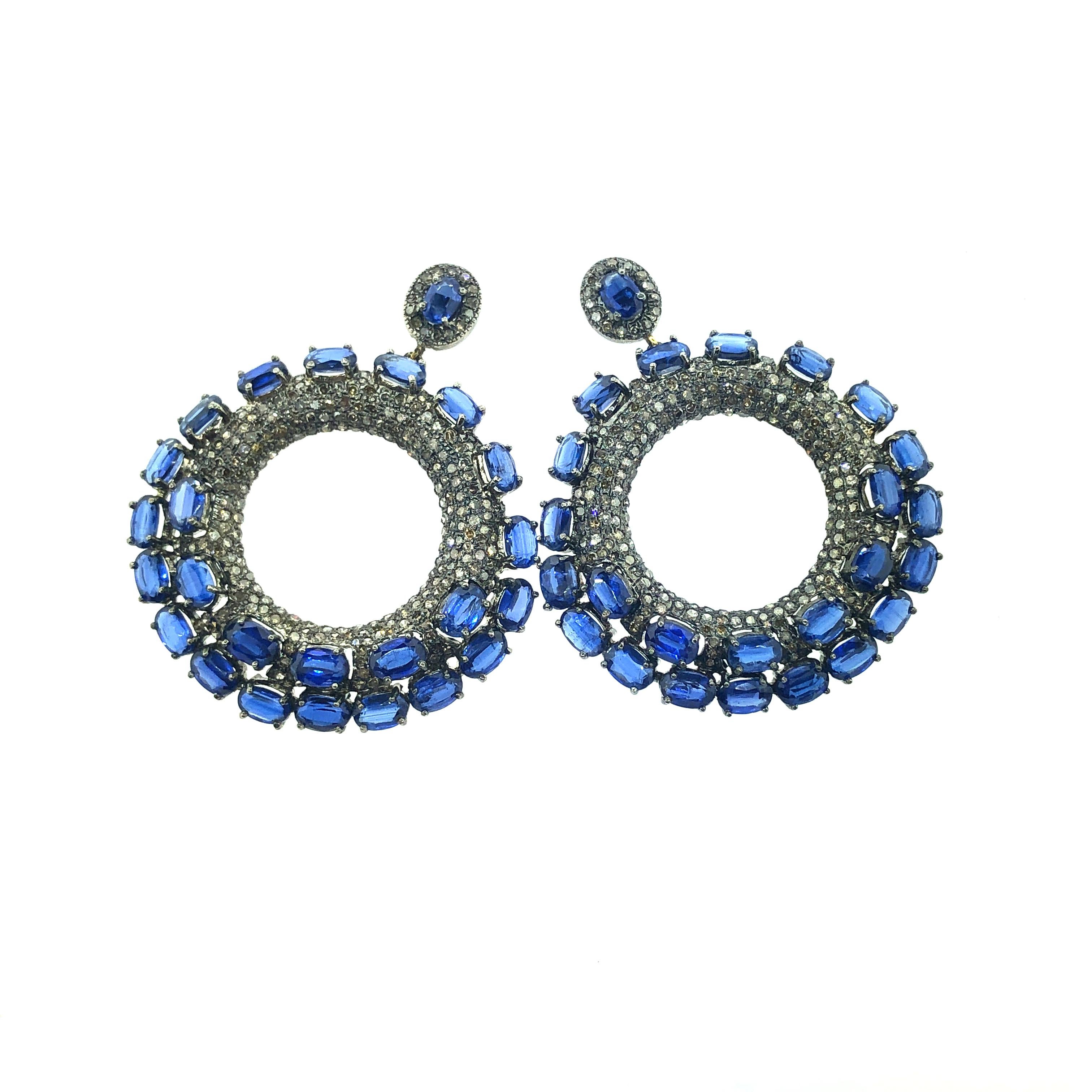 31.66 ct Kyanite Earrings set in Oxidized Sterling Silver with 14KT Gold posts and 4.80 ct Champagne Diamonds are made with real natural stones. The blue color of the Kyanite stone is deep and looks juts like the color of sapphire.  Each stone is