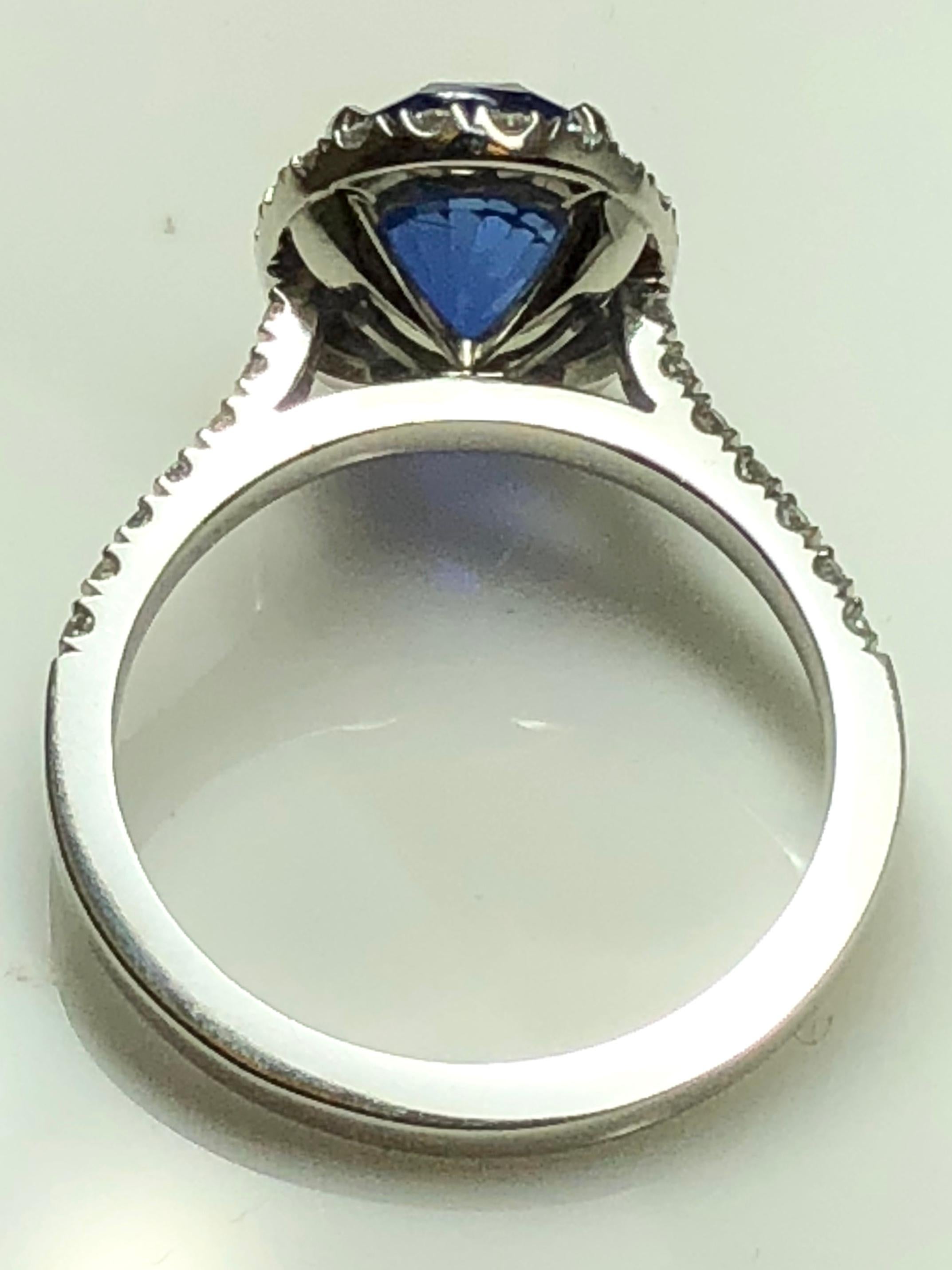 3.17 carat Blue Sapphire and  Halo Cluster Diamond ring in Platinum 5