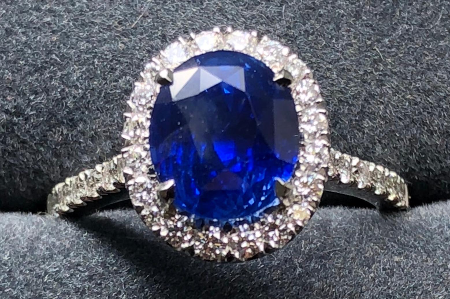 3.17 carat Blue Sapphire and  Halo Cluster Diamond ring in Platinum 6