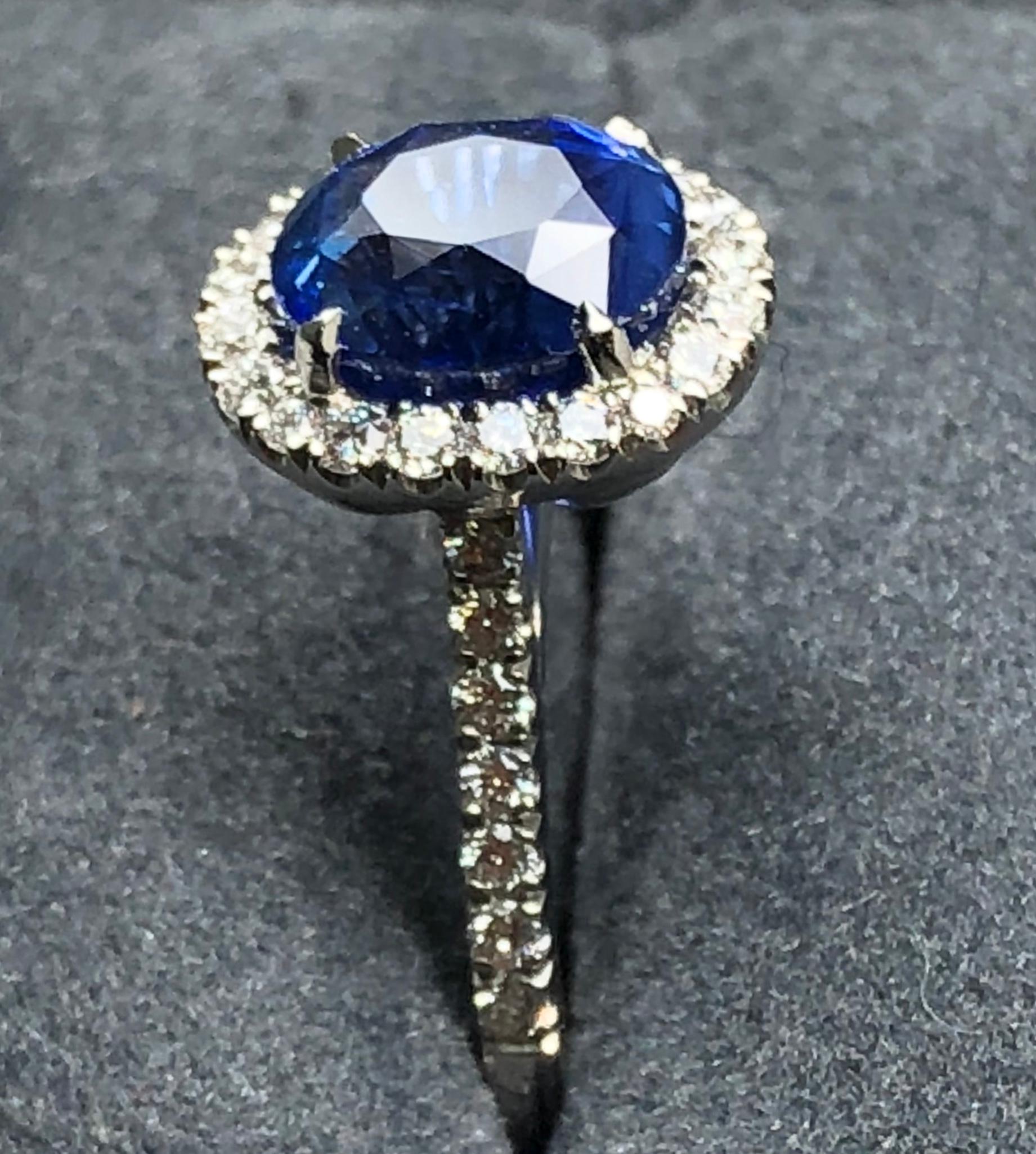 3.17 carat Blue Sapphire and  Halo Cluster Diamond ring in Platinum 7