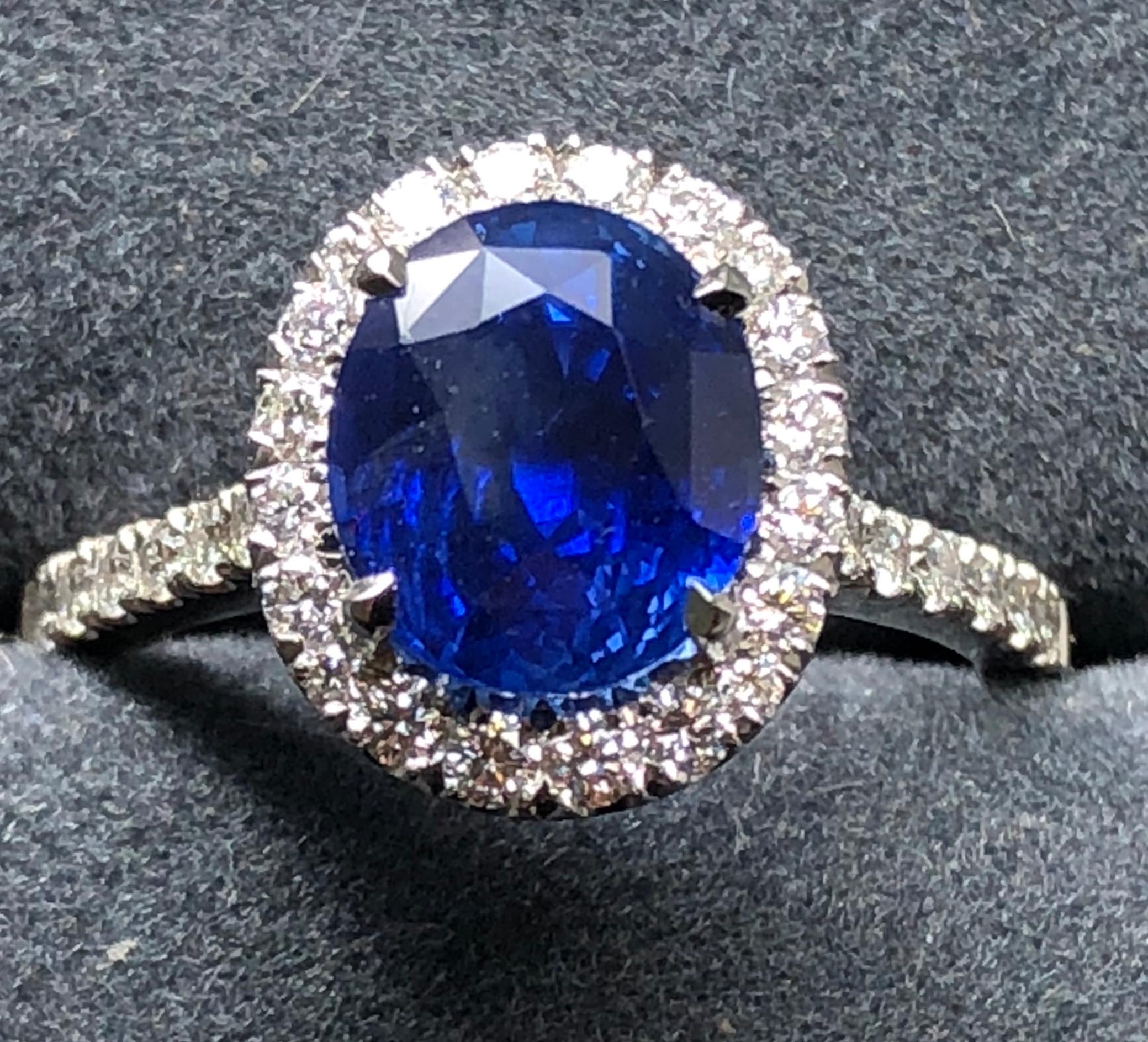 3.17 carat Blue Sapphire and  Halo Cluster Diamond ring in Platinum 8
