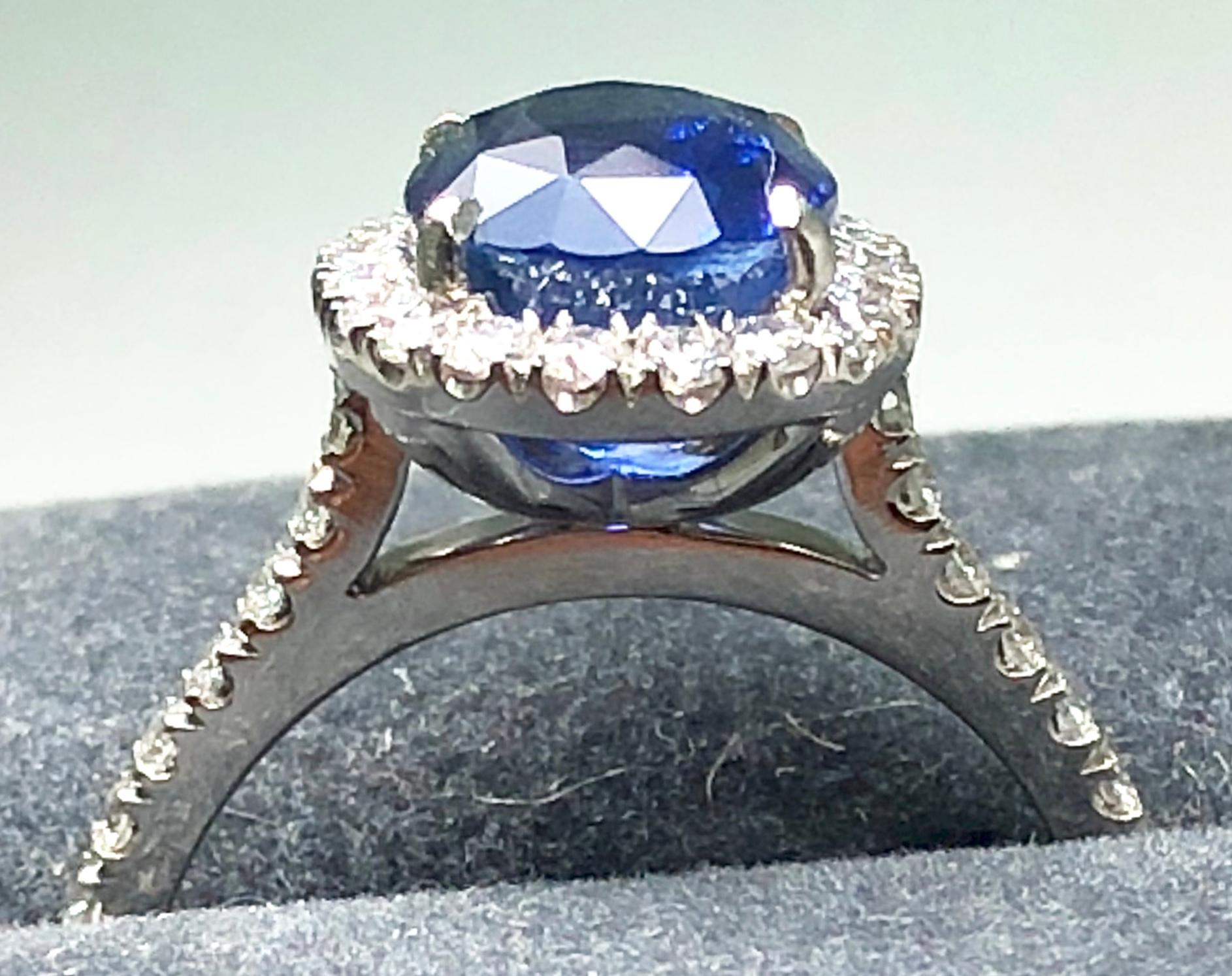 3.17 carat Blue Sapphire and  Halo Cluster Diamond ring in Platinum 9