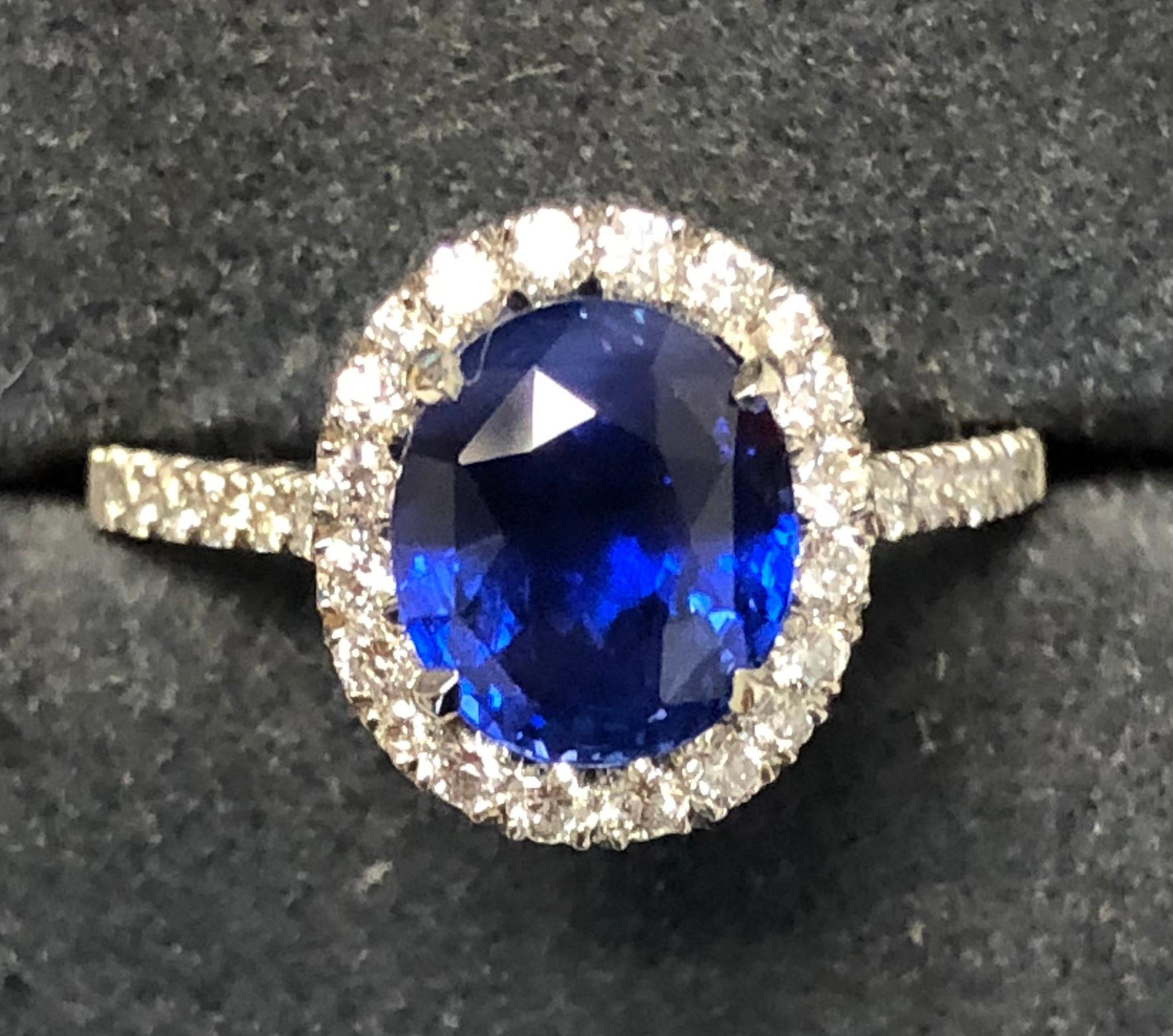 3.17 carat Blue Sapphire and  Halo Cluster Diamond ring in Platinum 10