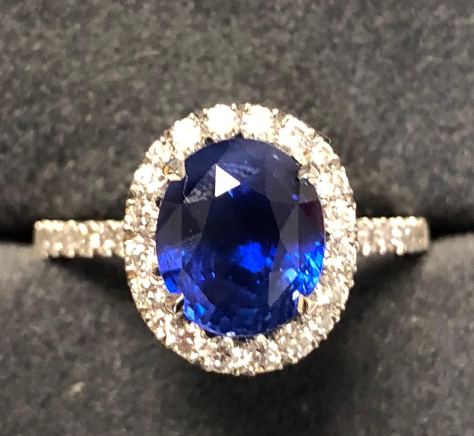 3.17 carat Blue Sapphire and  Halo Cluster Diamond ring in Platinum 11