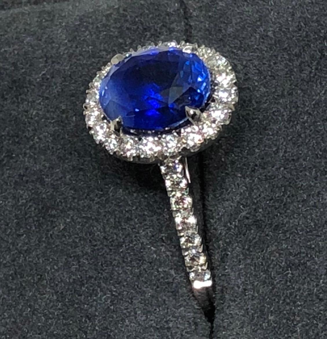 Oval Cut 3.17 carat Blue Sapphire and  Halo Cluster Diamond ring in Platinum