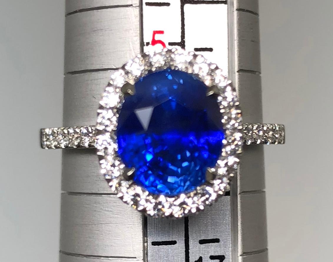 Women's 3.17 carat Blue Sapphire and  Halo Cluster Diamond ring in Platinum