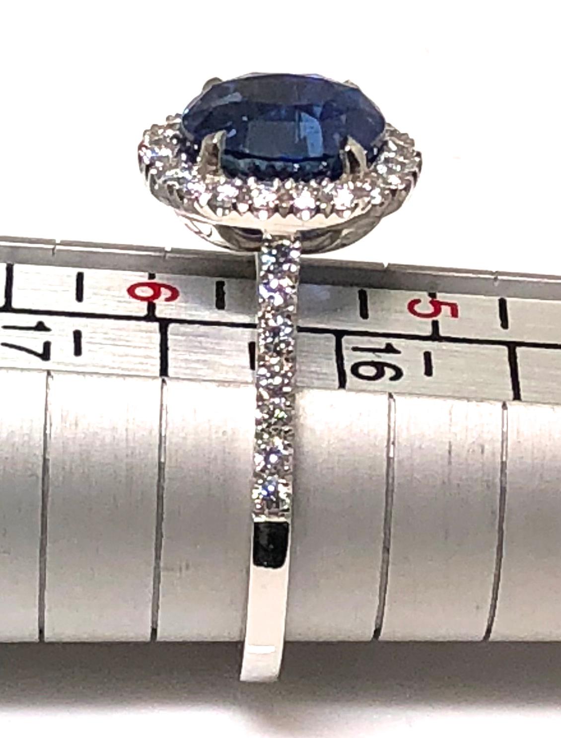 3.17 carat Blue Sapphire and  Halo Cluster Diamond ring in Platinum 1