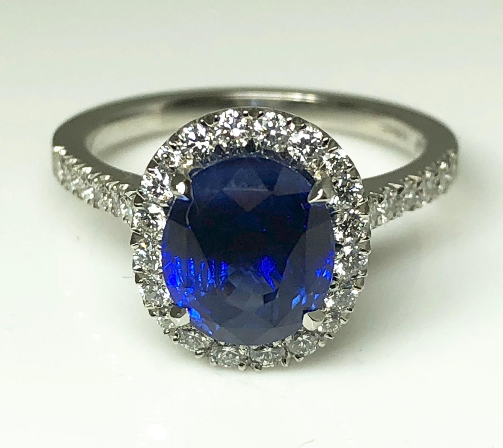 3.17 carat Blue Sapphire and  Halo Cluster Diamond ring in Platinum 3
