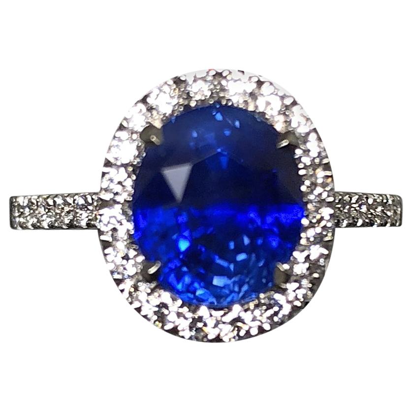 3.17 carat Blue Sapphire and  Halo Cluster Diamond ring in Platinum