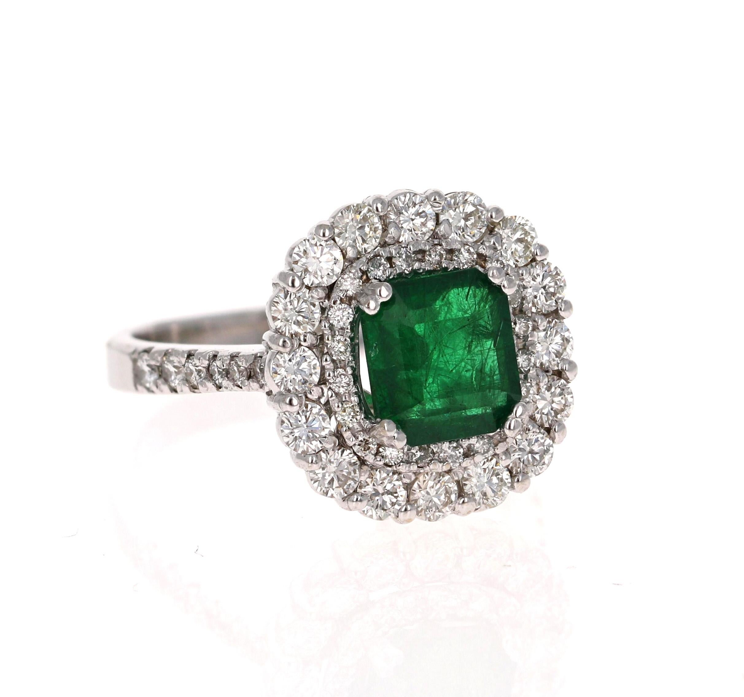 A beautiful double halo setting holding a Natural Square-Step Cut Emerald that weighs 2.00 Carats. Surrounded by a halo of Natural Round Cut Diamonds that weigh 1.17 Carats with a clarity & color of VS-H.  The total carat weight of the ring is 3.17