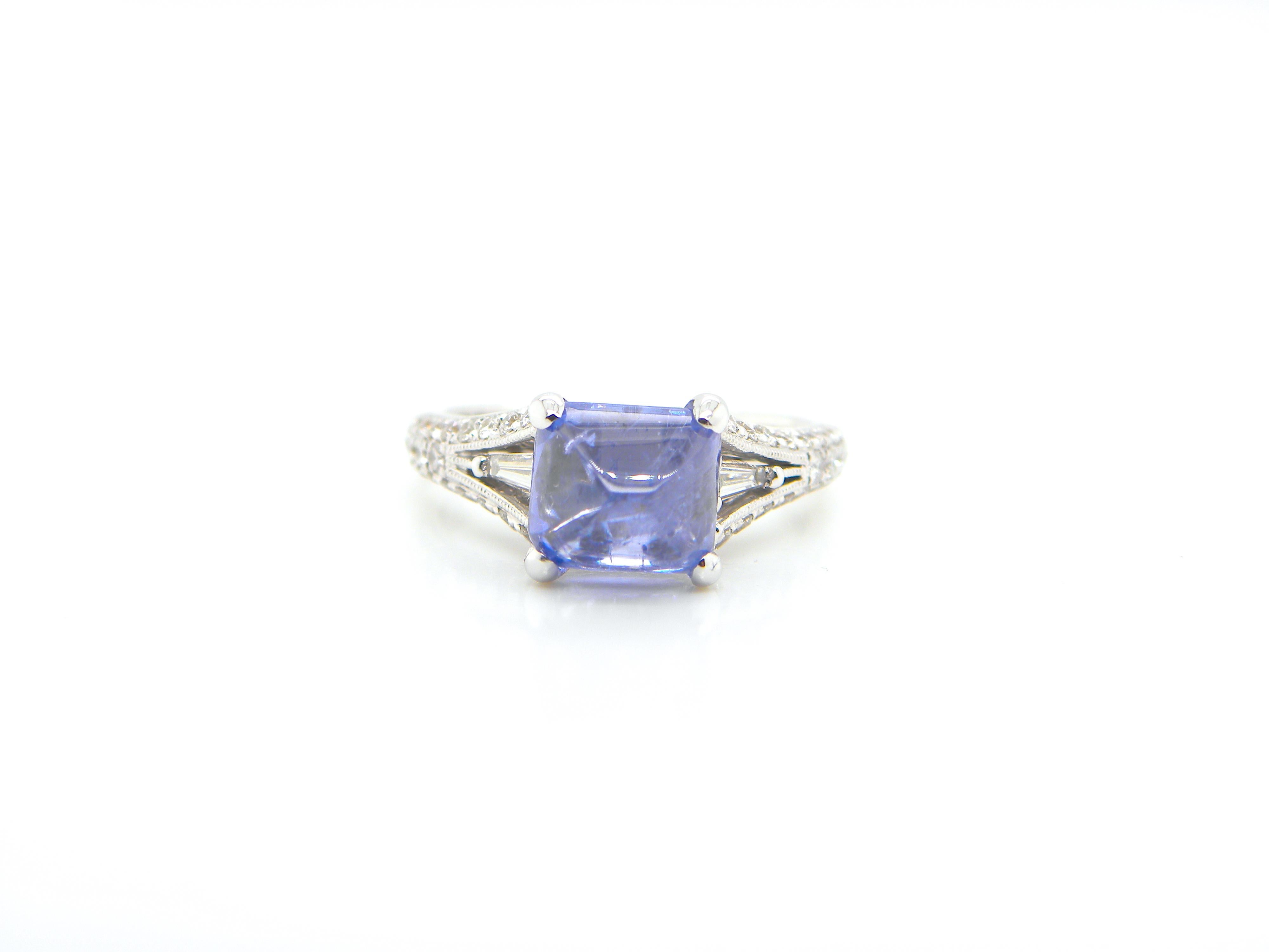 3.17 Carat GIA Certified Burma No Heat Colour Change Sapphire and Diamond Ring:

A playful ring, it features a beautiful GIA certified natural unheated Burmese sugarloaf colour-change blue sapphire weighing 3.17 carat flanked by a flurry of white
