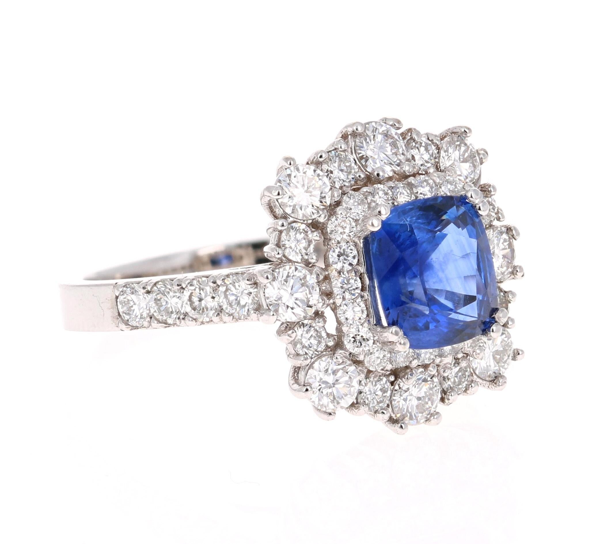 Beautiful Sapphire Diamond ring with an intricate setting! 

This ring has a Blue Sapphire that weighs 1.78 Carats and is GIA Certified. The Sapphire is a natural Blue Cushion Cut with indications of heating. The GIA Certificate Number is: