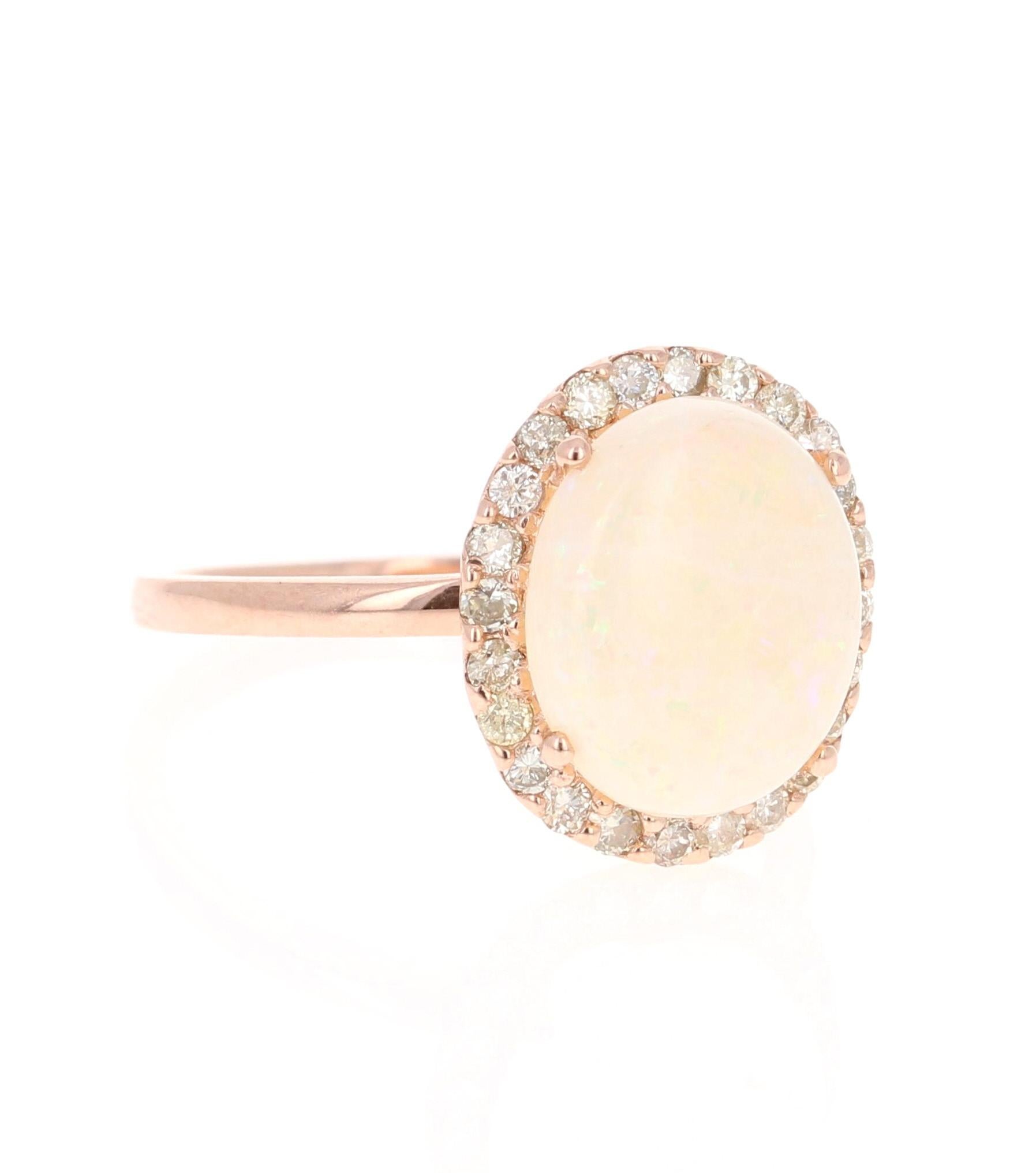 One Of A Kind Opal Diamond Ring! 

This ring has a 2.77 Carat Opal that is curated in a 14 Karat Rose Gold setting. The setting is adorned with 24 Round Cut Diamonds that weigh 0.40 Carats. The total carat weight of the ring is 3.17 Carats.

The