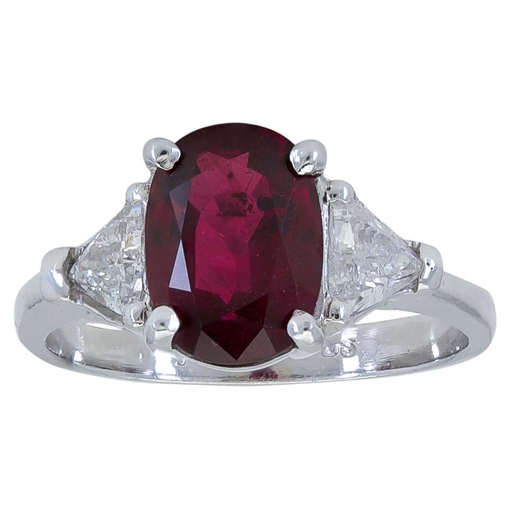 3.17 Carat Oval Cut Ruby and Diamond Three-Stone Engagement Ring For Sale