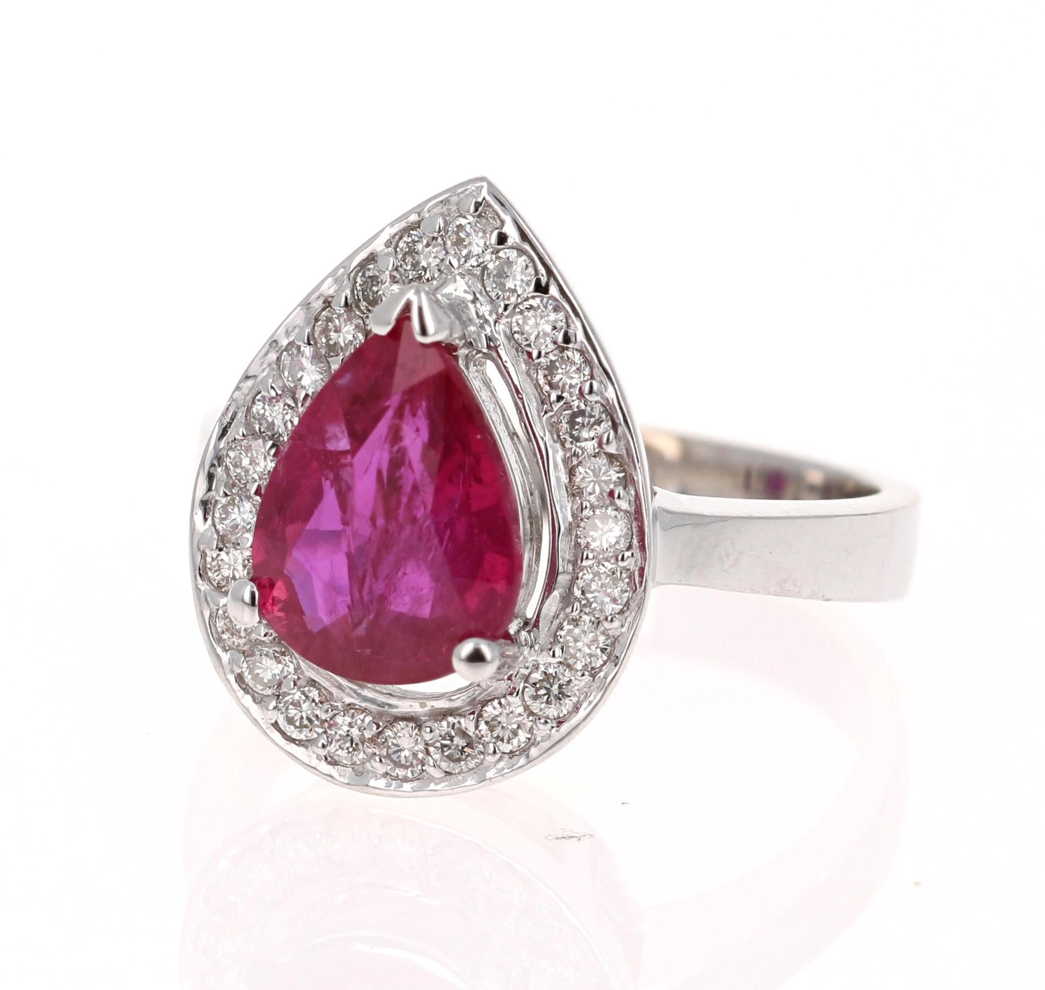 
This ring has a gorgeous Pear Cut Ruby set in the center of the ring.  The Ruby has origins from Southern Africa (Republic of Mozambique) and it weighs 2.78 Carats. It has a Halo of 26 Round Cut Diamonds weighing 0.39 Carats. (Clarity: VS2, Color: