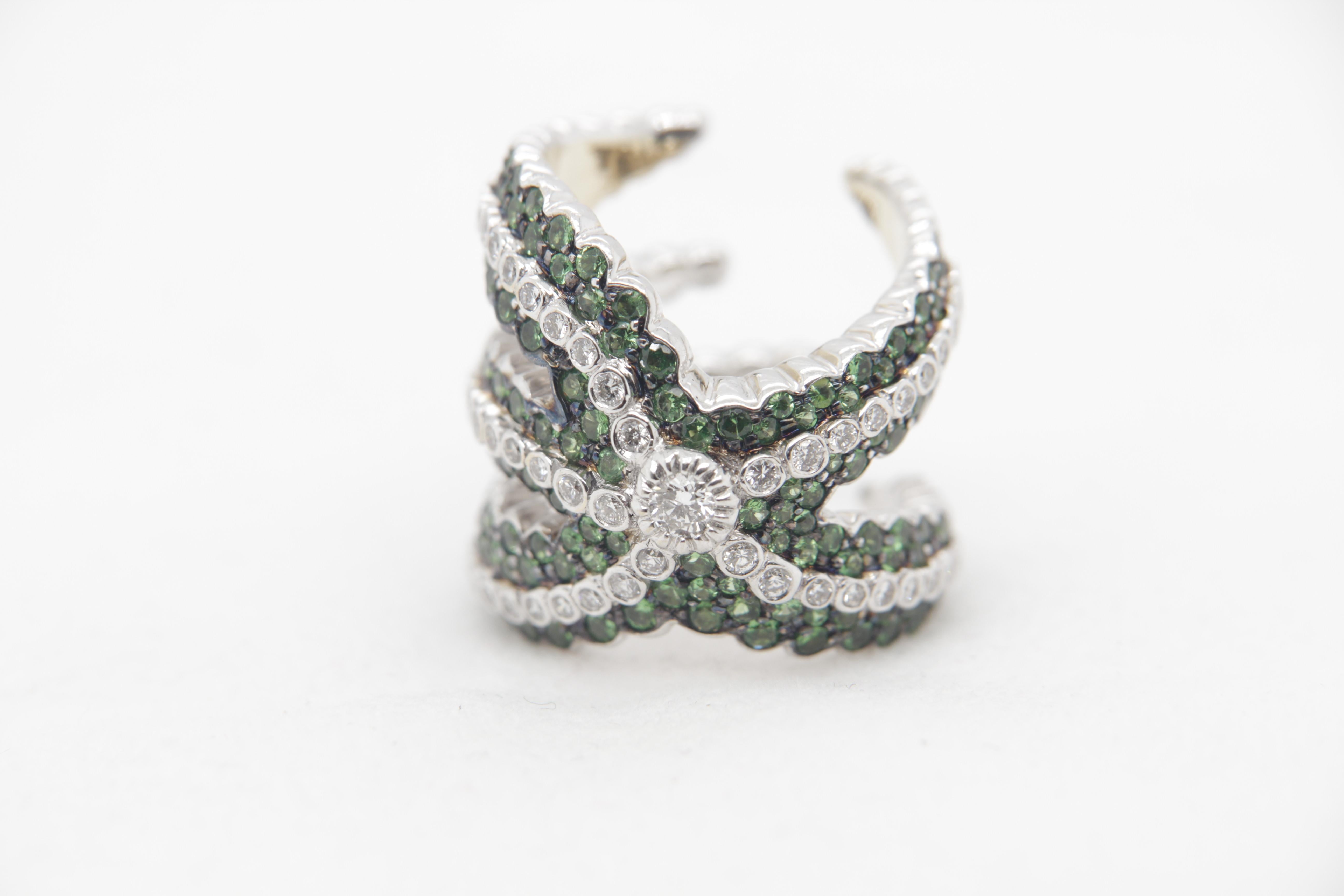 A brand new tsavorite and diamond ring in 18 karat gold. The tsavorite weigh 3.17 carat and diamond weigh 1.51 carat. The total ring weight is 20.89 grams. 