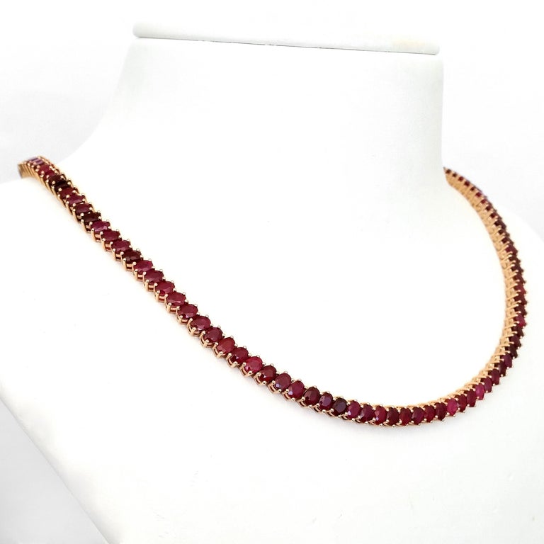 This uniquely beautiful necklace consists of 134 purplish red, mixed oval rubies totaling 31.75 carats set in 14kt pink gold. This amazing necklace is the right choice for a special occasion and it will give you a simple but very elegant appearance.