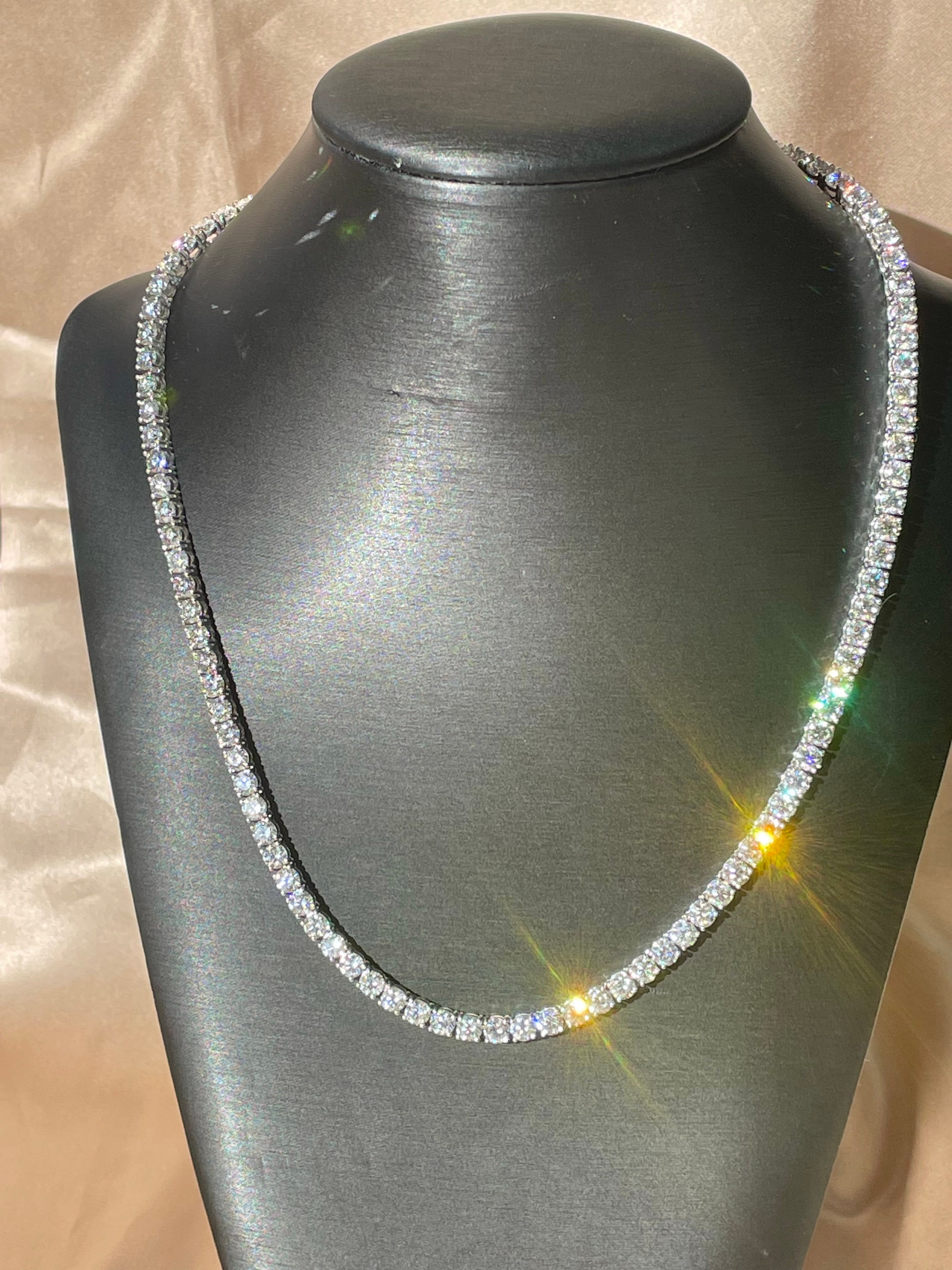 Classic and versatile necklace that can be pulled together with any outfit. This show stopping array of round natural diamonds is in a prong setting and is lined up perfectly to create the most elegant head turner diamond necklace. The pièce de