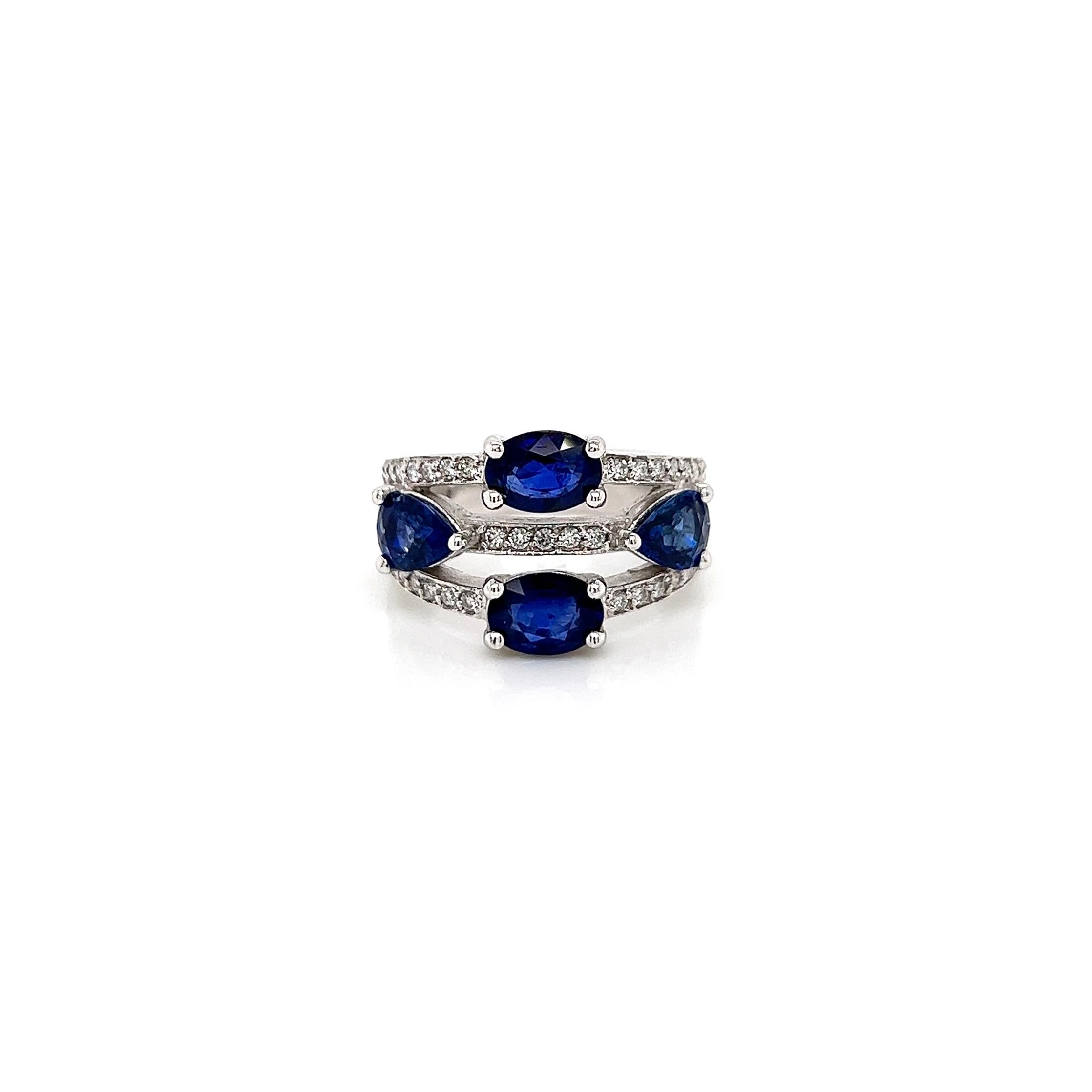3.71 Total Carat Sapphire Diamond Ladies Ring

-Metal Type: 14K White Gold
-3.17 Carat Pear Shaped and Oval Blue Sapphires
-0.54 Carat Round Side Diamonds, F-G color, VS-SI clarity
-Size 7.25

Made in New York City.