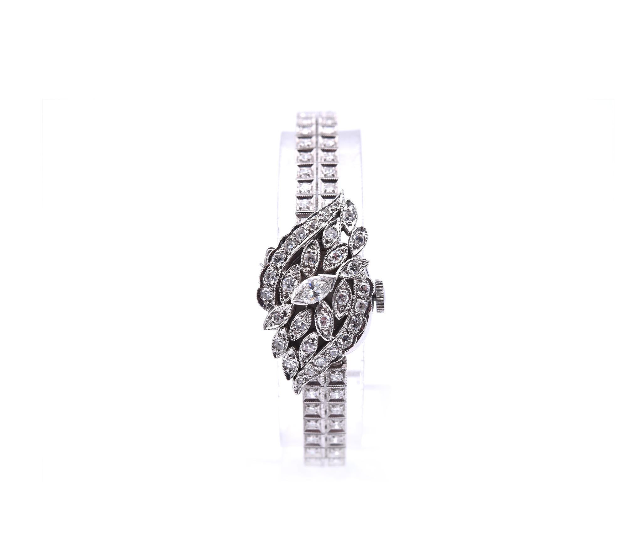 Movement: manual wind movement
Function: hours, minutes
Diamonds: 3.18 carat total weight
Color: G-H
Clarity: VS
Case: round 18mm x 15.5mm 14k white gold case with plastic crystal, flip-top set with diamonds, solid-case back
Dial: white dial with