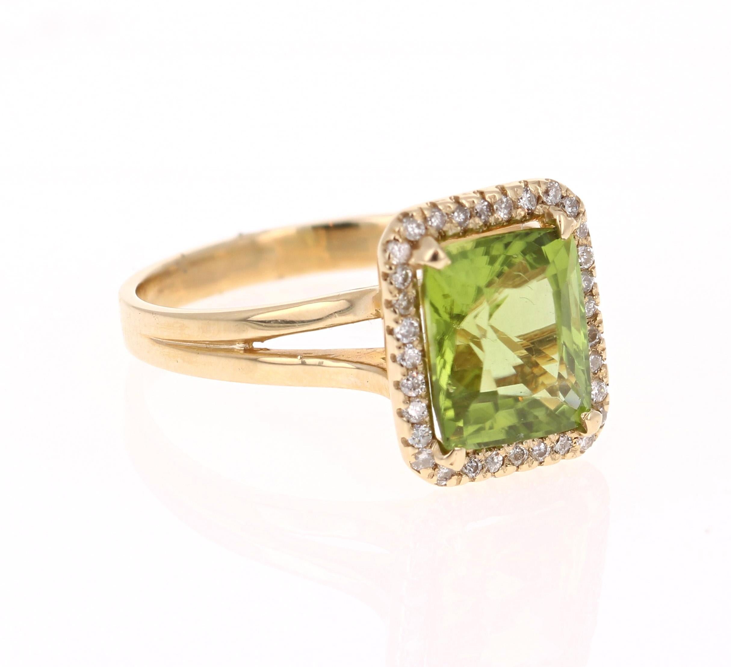 This Peridot and Diamond Ring has a 3.01 Carat Emerald Cut Peridot and has a halo of 32 Round Cut Diamonds weighing 0.17 Carats. The total carat weight of the ring is 3.18 Carats. 

It is set in 14 Karat Yellow Gold and weighs approximate 3.2 grams.