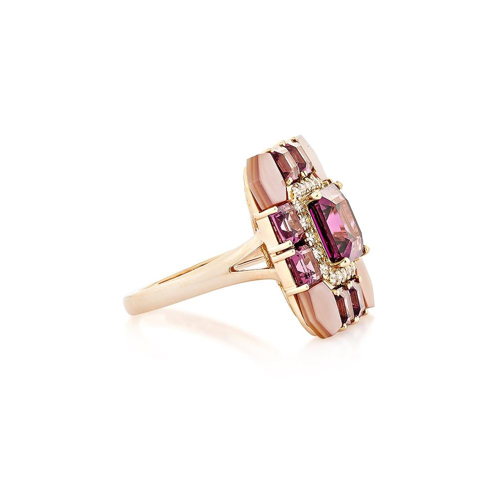 This lovely pinkish-red rhodolite ring is set in an octagon shape! The mother of pearls that embrace the ring's four corners add to its beauty and elegance. This trendy ring is suitable for any event or gathering. These gemstones with diamonds are