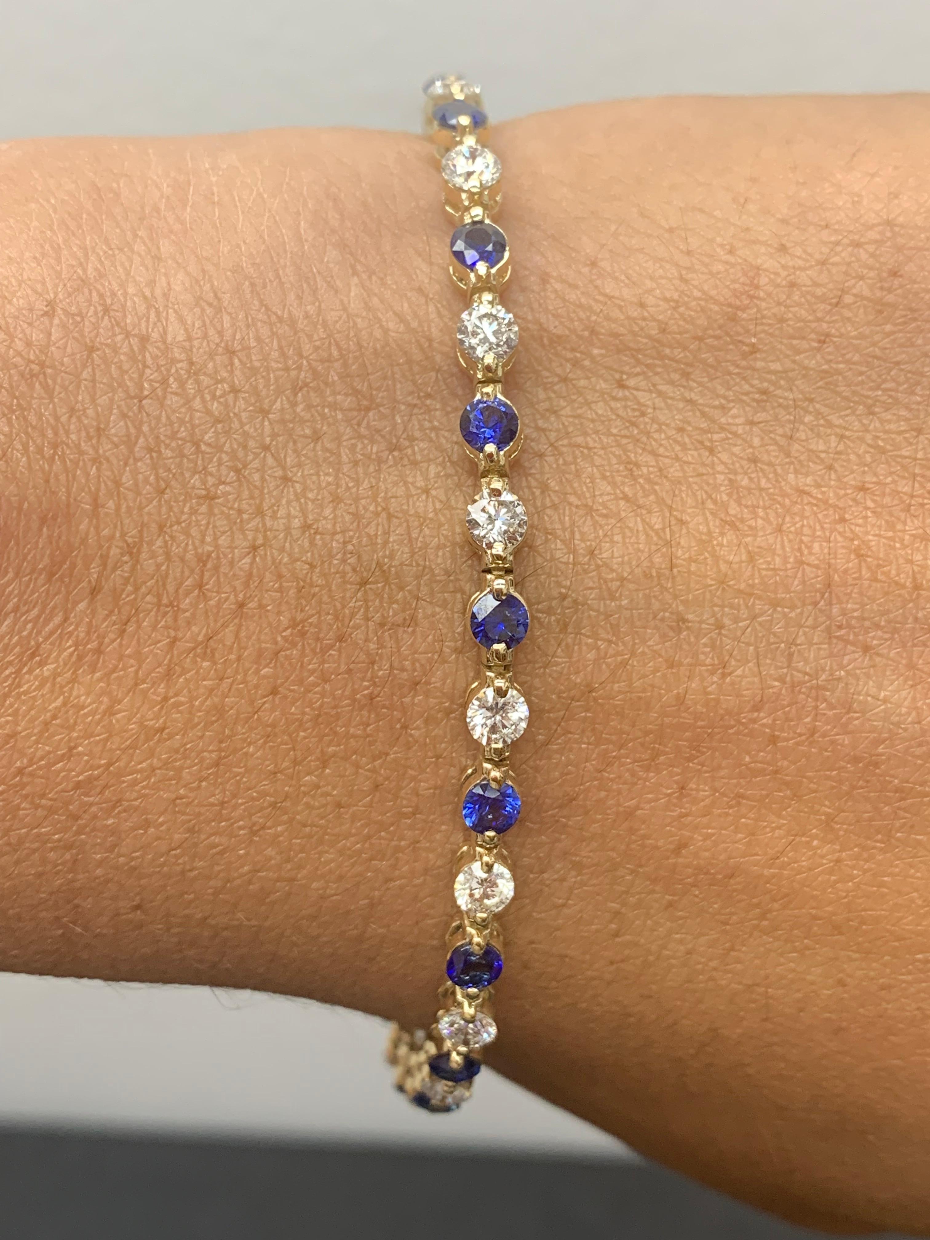 A stunning bracelet set with 18 stunning Blue sapphires weighing 3.18 carat total. Alternating these Blue Sapphires are 18 sparkling round diamonds weighing 2.88 carats in total. Set in polished 14k yellow gold. Double lock mechanism for maximum