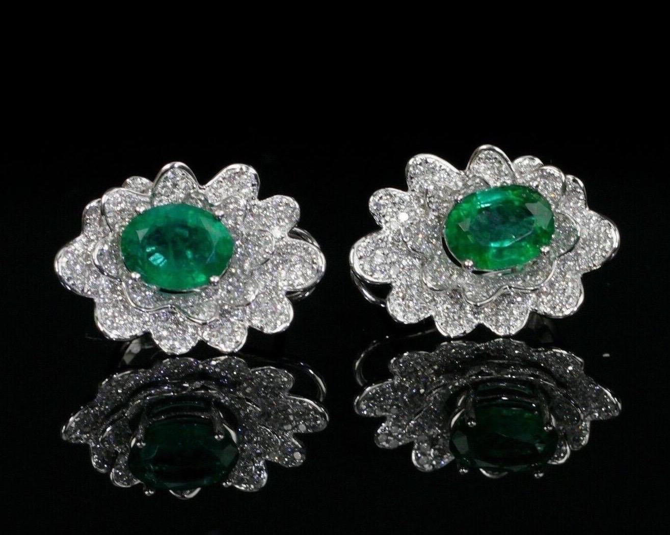 Cast in 14 karat white gold, these stunning stud earrings are hand set with 3.18 carats emerald and 1.37 carats of glimmering diamonds. 

FOLLOW MEGHNA JEWELS storefront to view the latest collection & exclusive pieces. Meghna Jewels is proudly